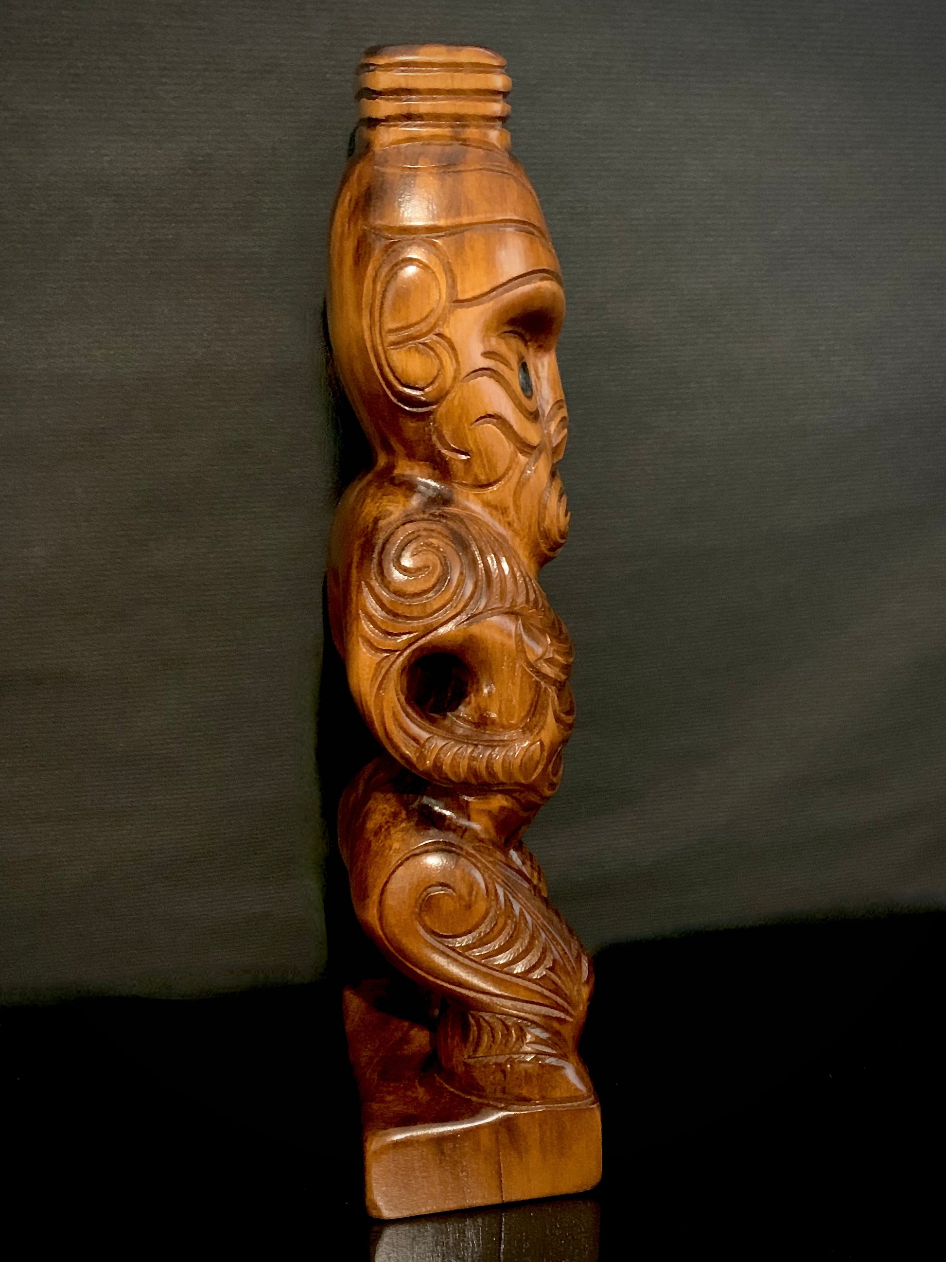 right side detail of Maori teko teko statue carved in New Zealand and available from Silver Fern Gallery
