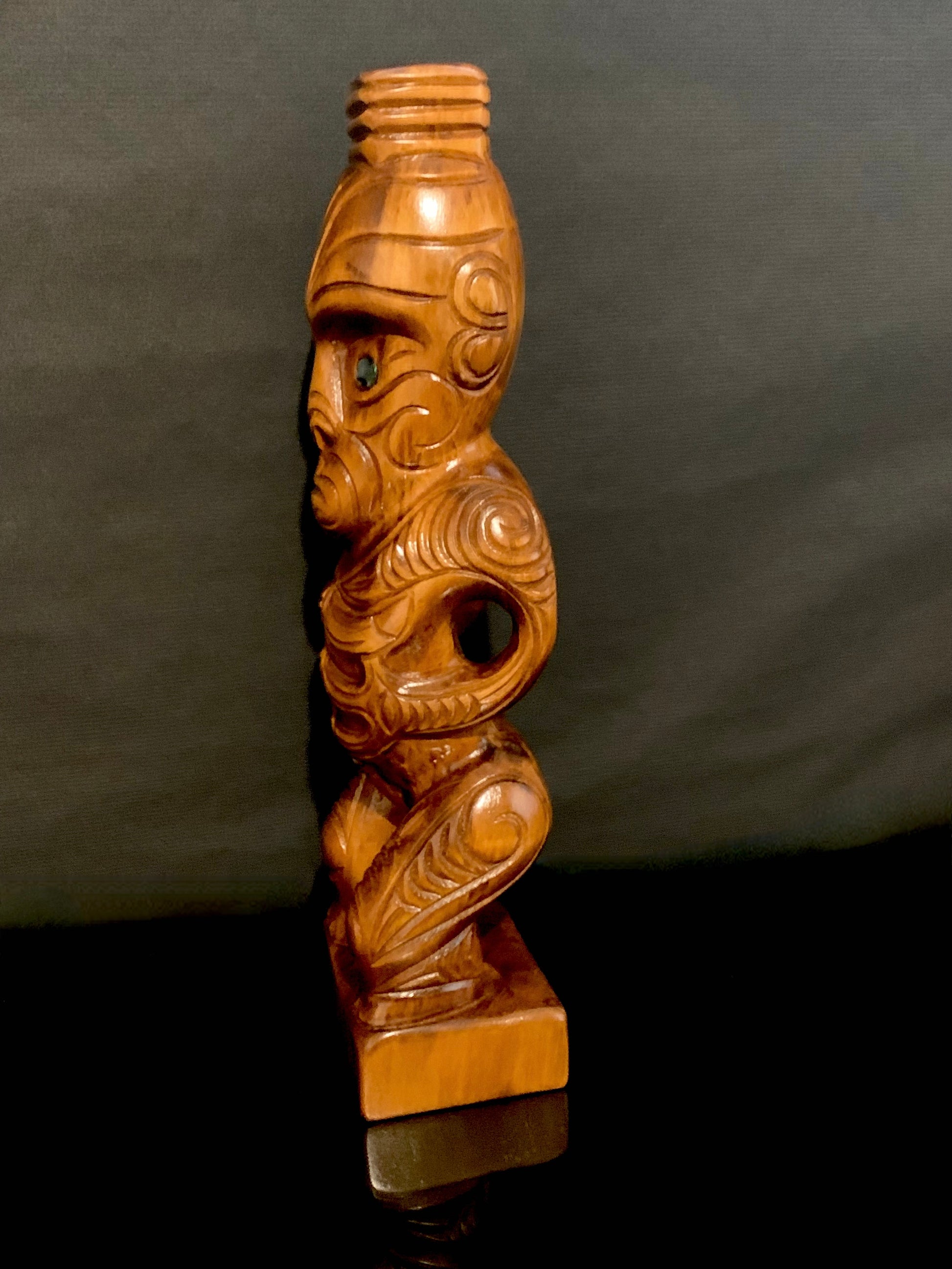 side detail of Maori teko teko statue carved in New Zealand and available from Silver Fern Gallery
