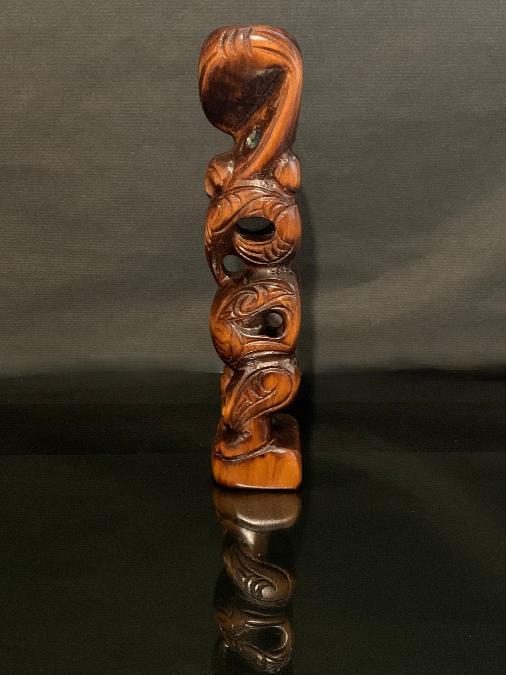 side view looking left of small Maori teko teko carved in New Zealand by Wood Masters available from Silver Fern Gallery