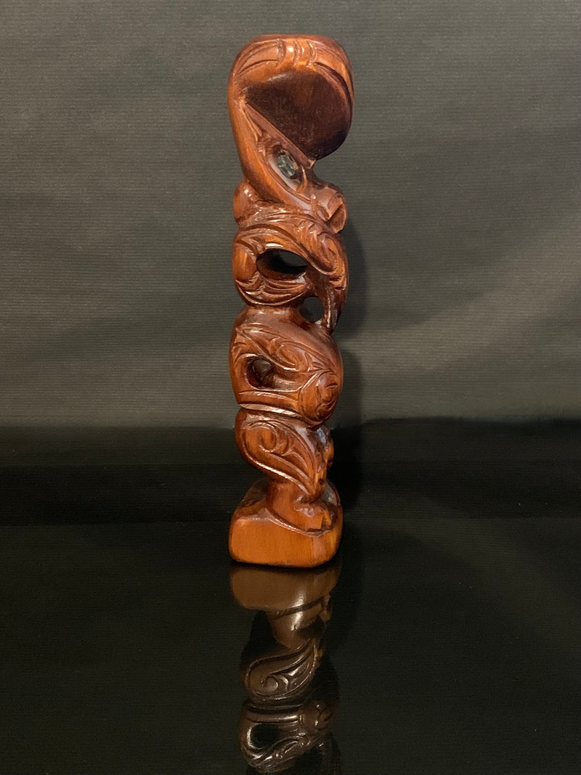 side view of small Maori teko teko carved in New Zealand by Wood Masters available from Silver Fern Gallery