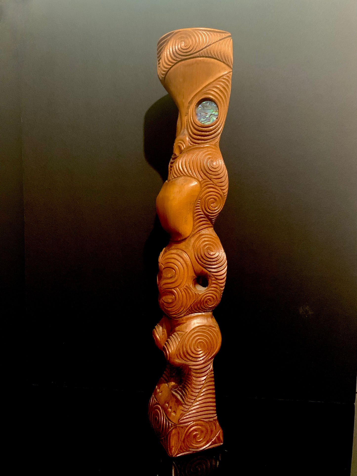 side view of Maori teko teko statue carved in New Zealand and available from Silver Fern Gallery