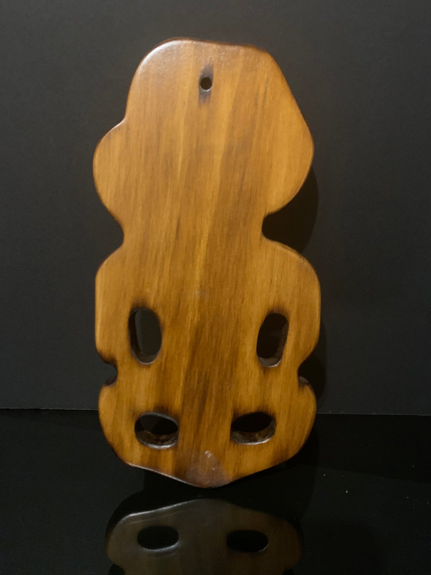 back of Maori wall tiki carved in New Zealand by Wood Masters available from Silver Fern Gallery