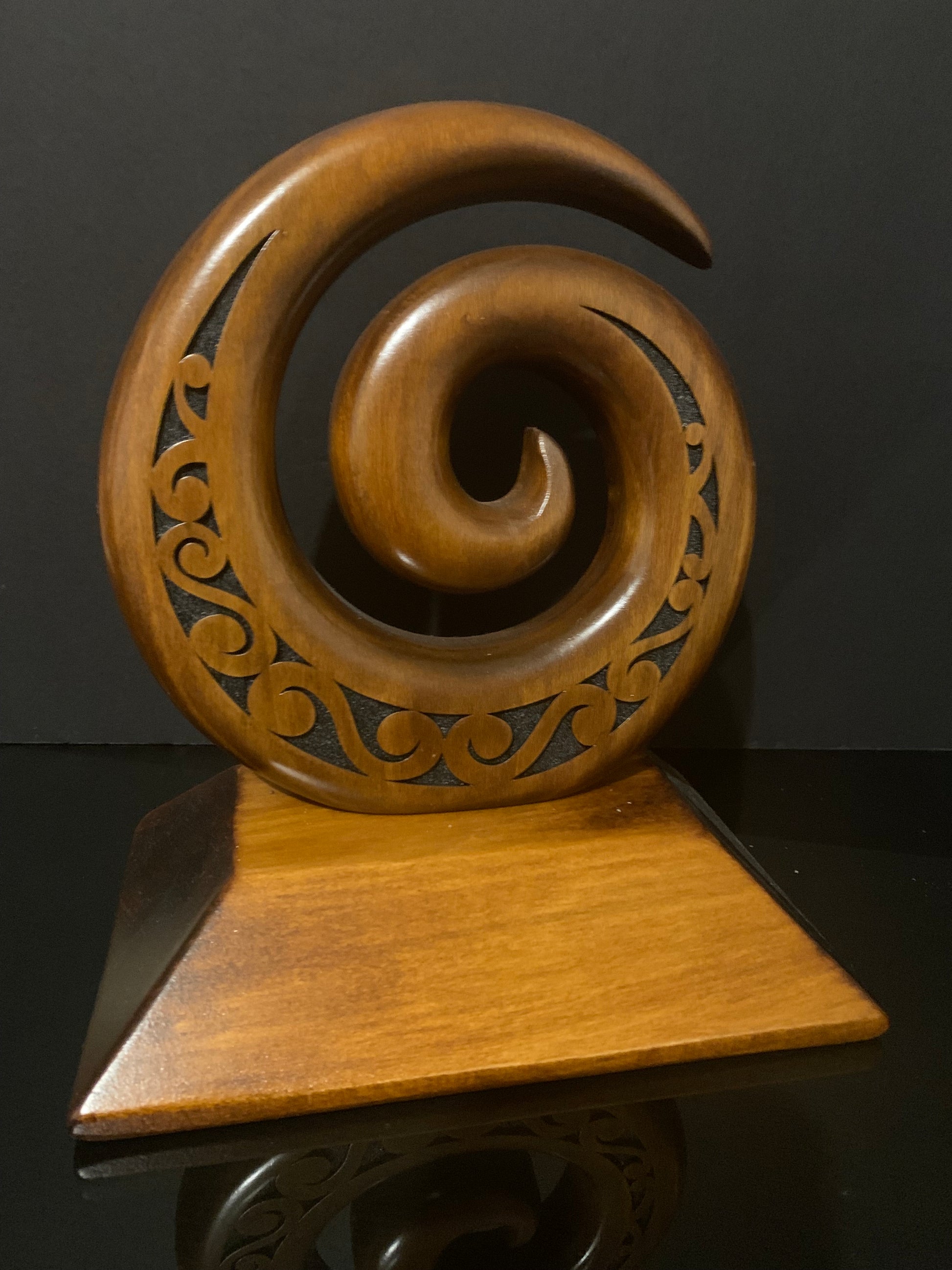 Koru carved in New Zealand and available from Silver Fern Gallery