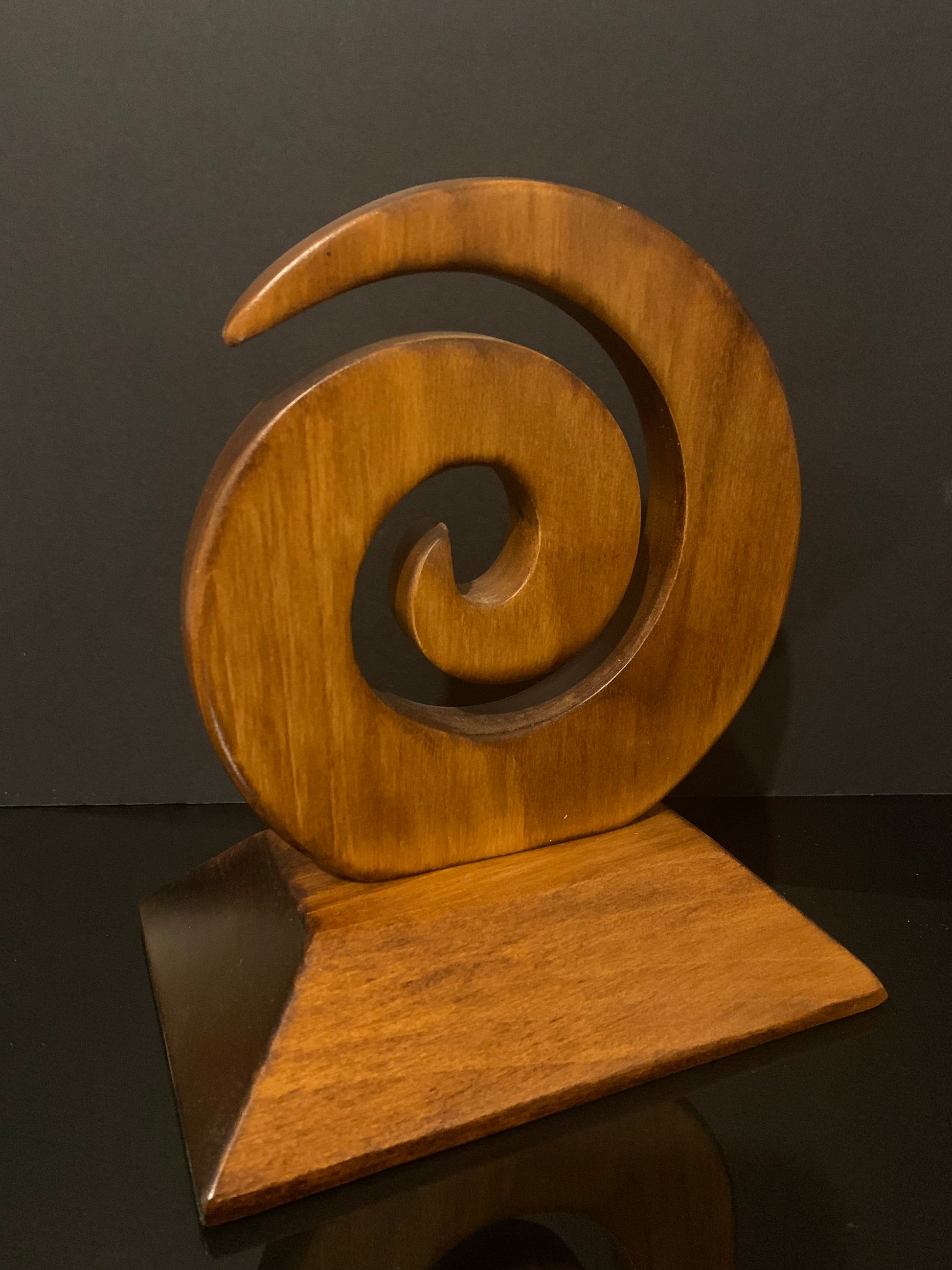 back view of Koru carved in New Zealand and available from Silver Fern Gallery