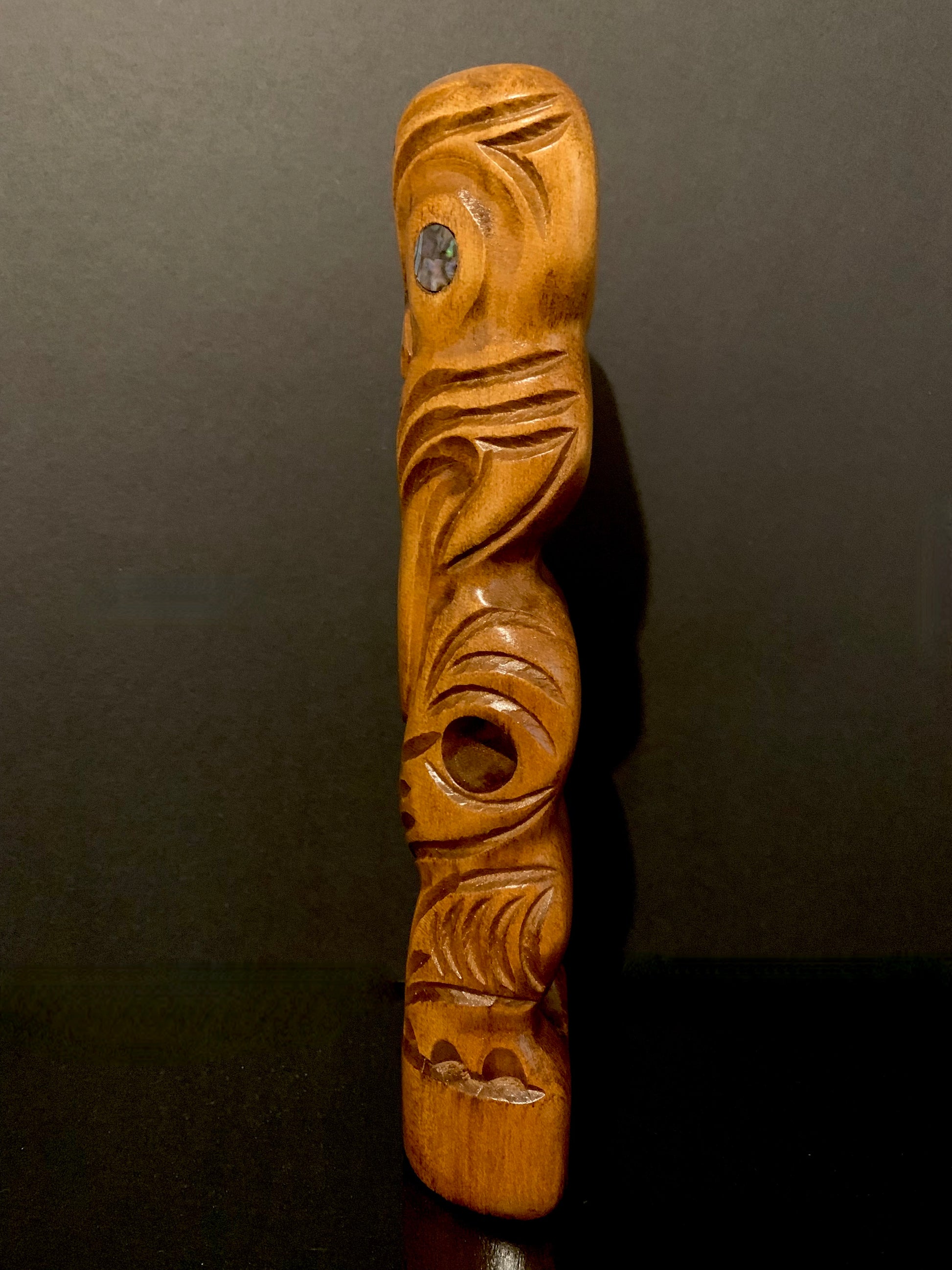 side view of small Maori teko teko carved in New Zealand by Wood Masters available from Silver Fern Gallery