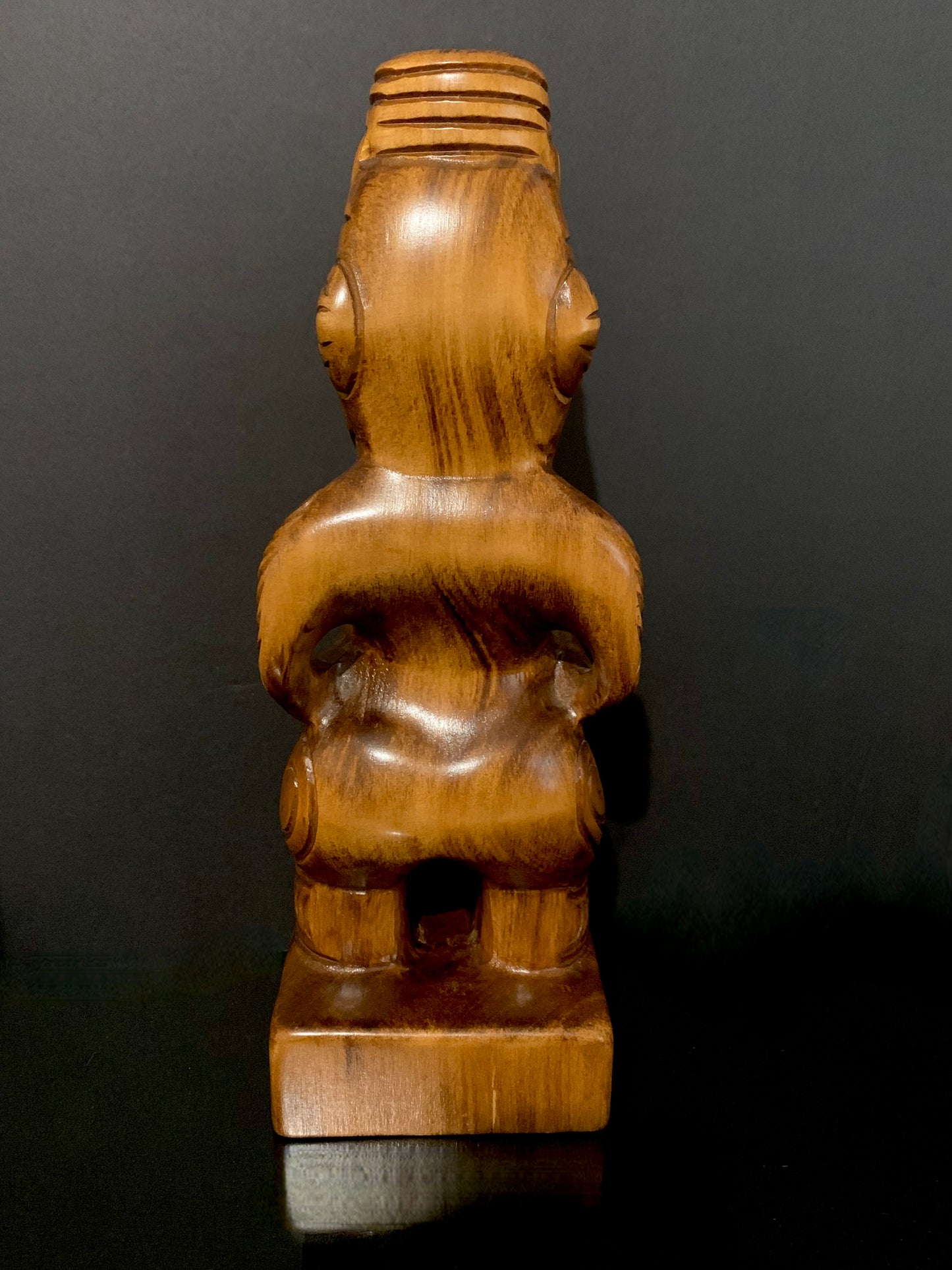 back view of Maori teko teko with patu carved in New Zealand by Wood Masters available from Silver Fern Gallery
