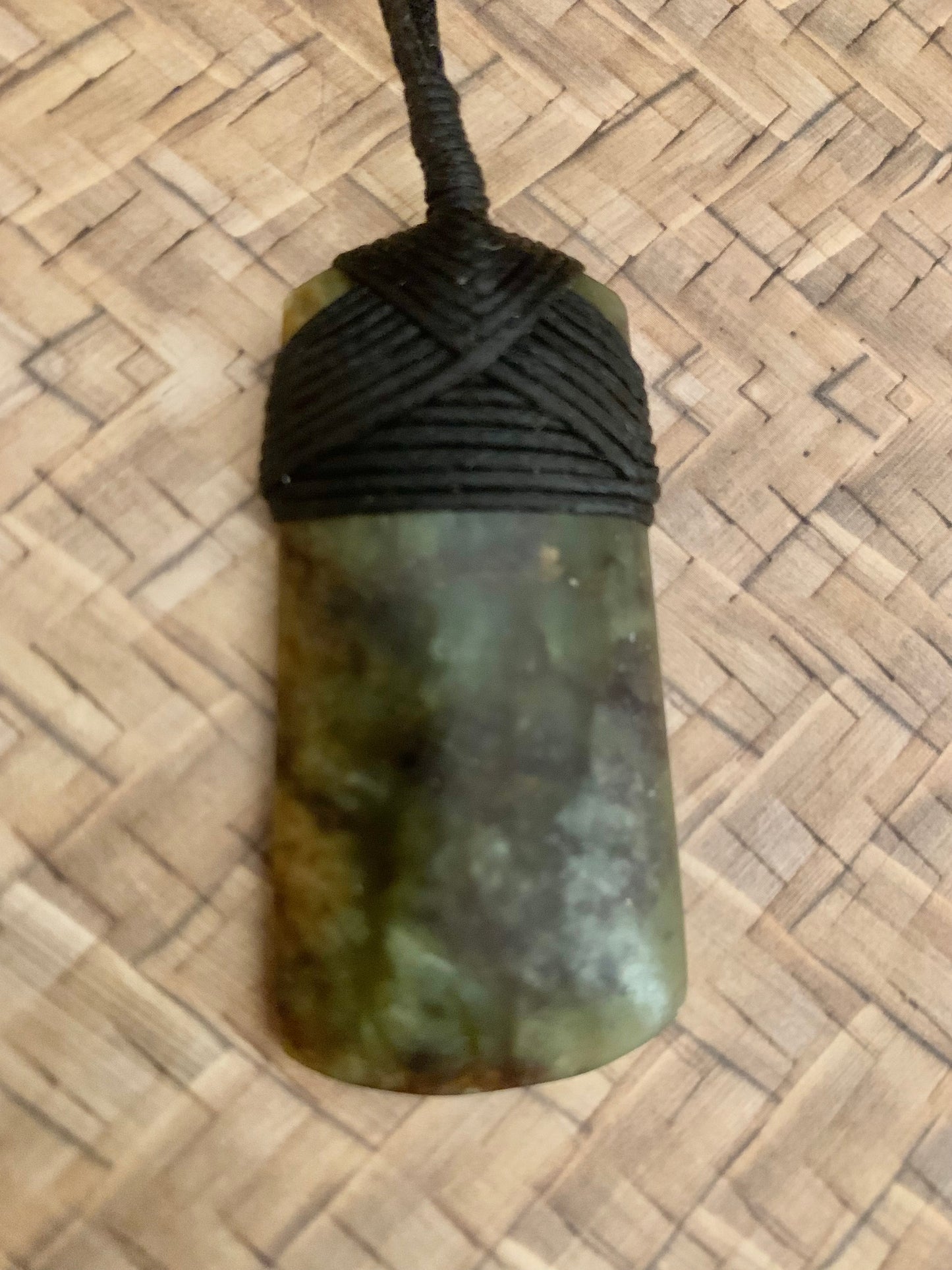 Maori Pounamu hei toki pendant from New Zealand available to purchase at Silver Fern Gallery