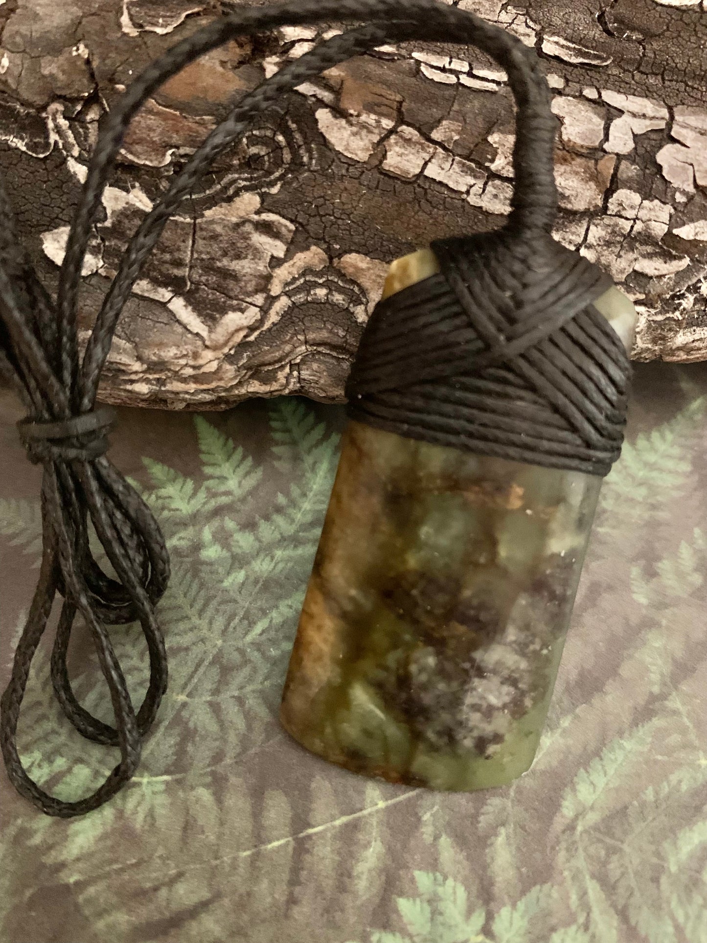 Maori Pounamu hei toki pendant from New Zealand available to purchase at Silver Fern Gallery