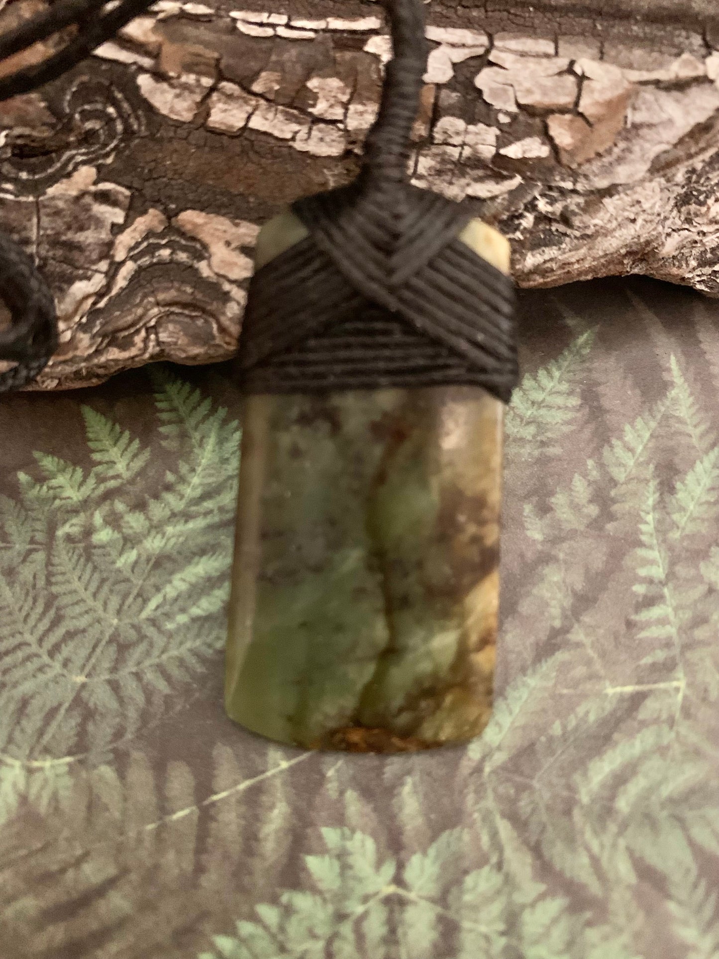 Maori Pounamu hei toki pendant from New Zealand available to purchase at Silver Fern Gallery
