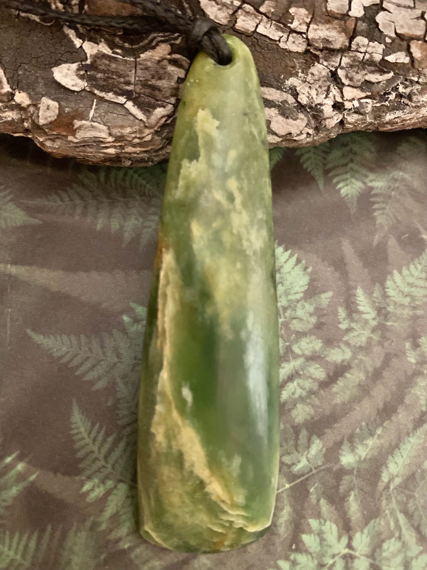 Front view of Pounamu drop pendant from New Zealand available from Silver Fern Gallery