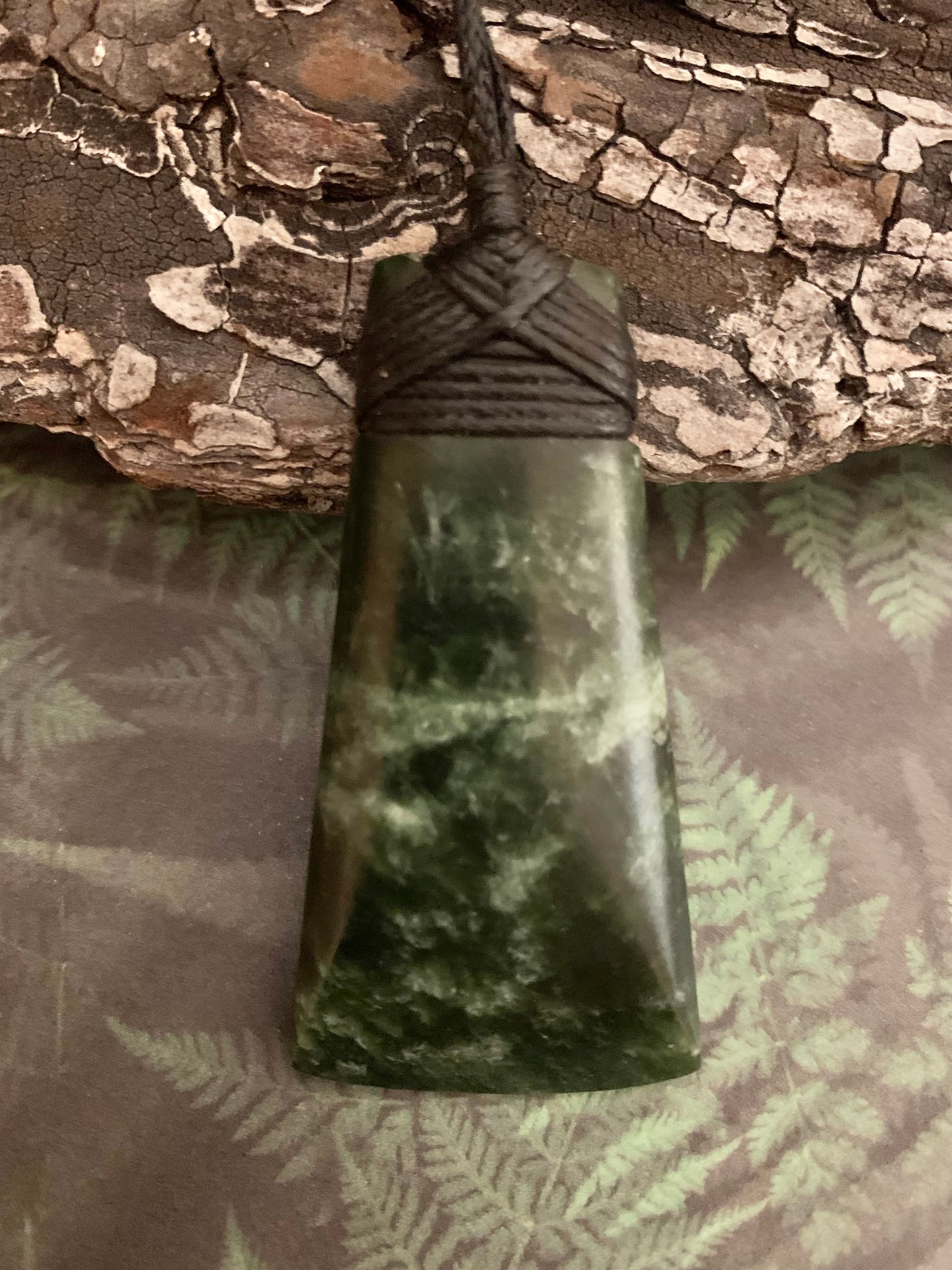 Maori Pounamu hei toki adornment from New Zealand available at Silver Fern Gallery