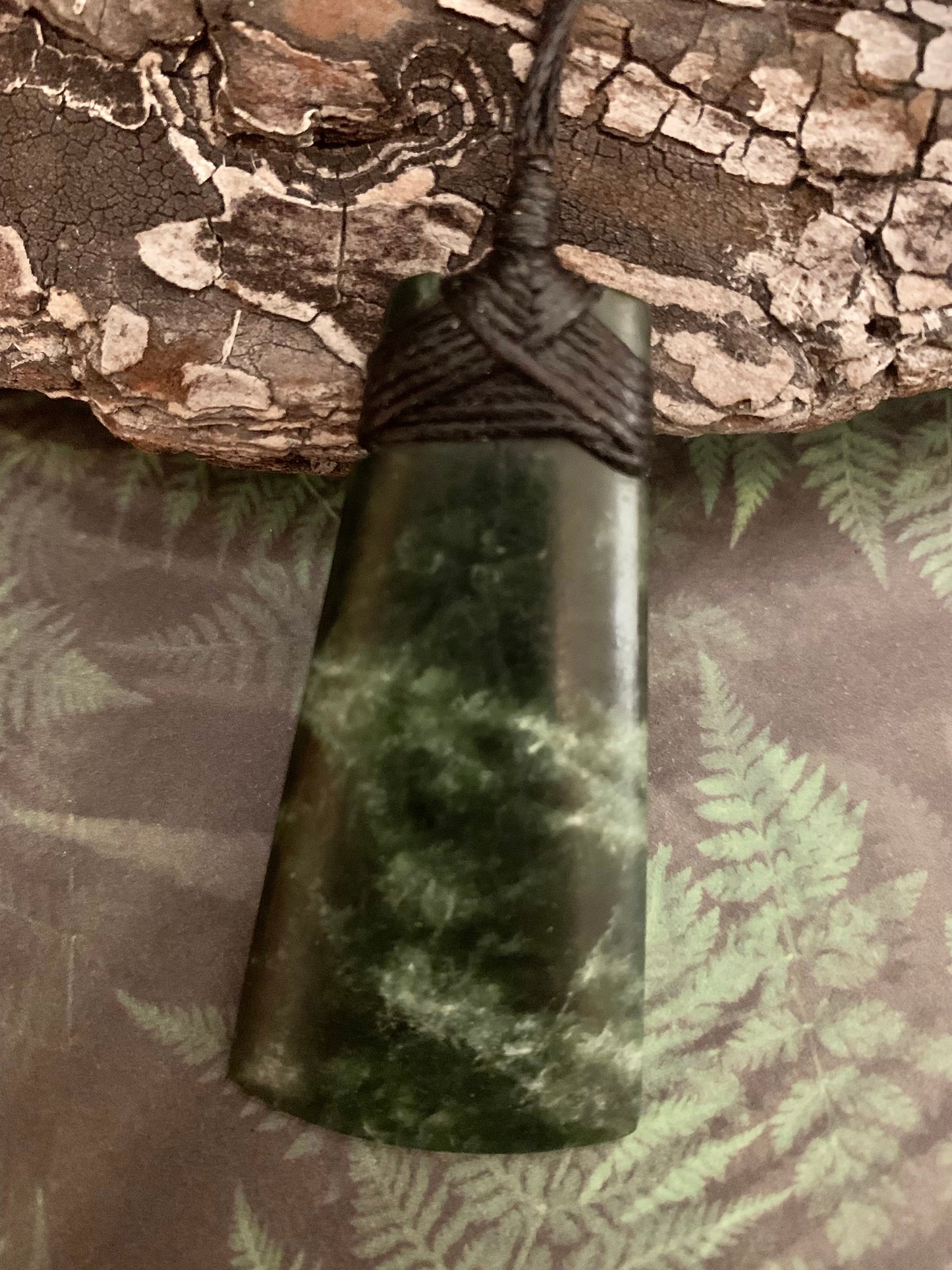 Maori Pounamu hei toki adornment from New Zealand available at Silver Fern Gallery