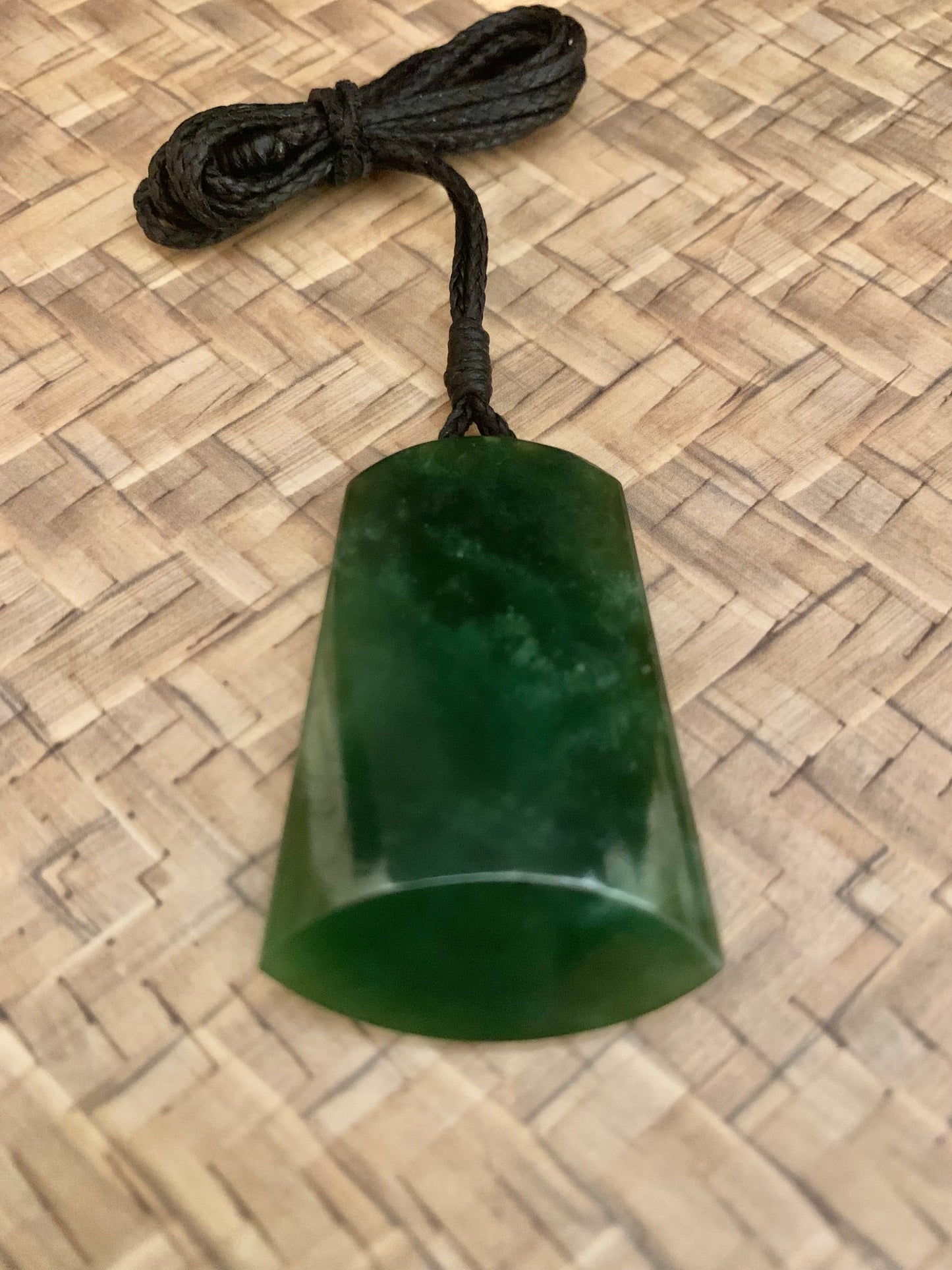 Maori Pounamu hei toki adornment from New Zealand available at Silver Fern Gallery
