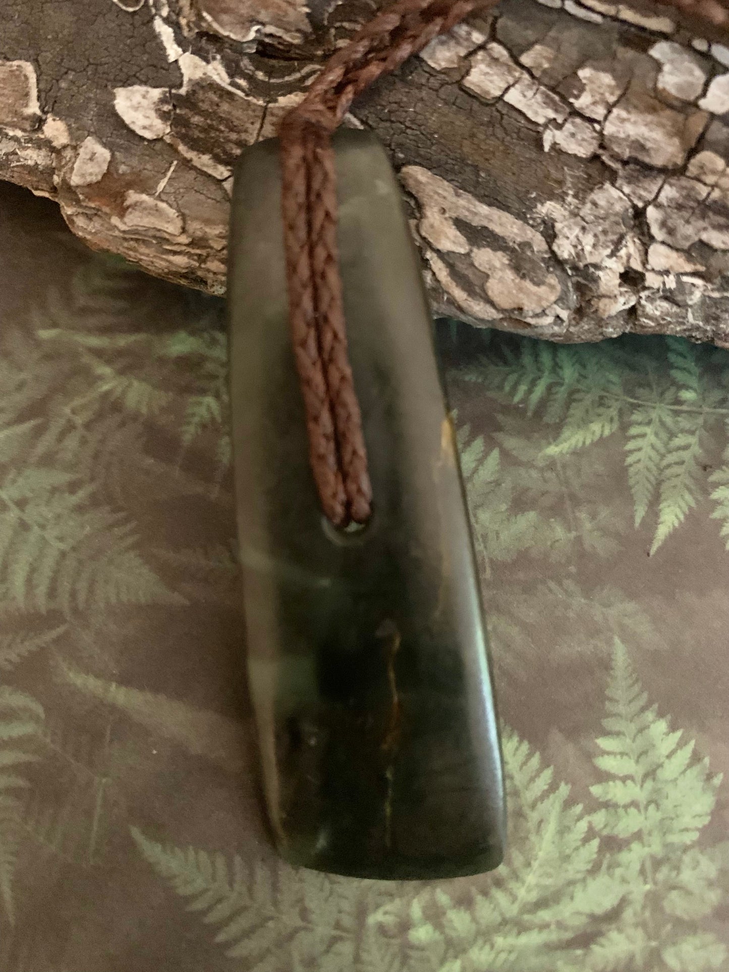 frront view of Maori Pounamu hei toki pendant from New Zealand available to purchase