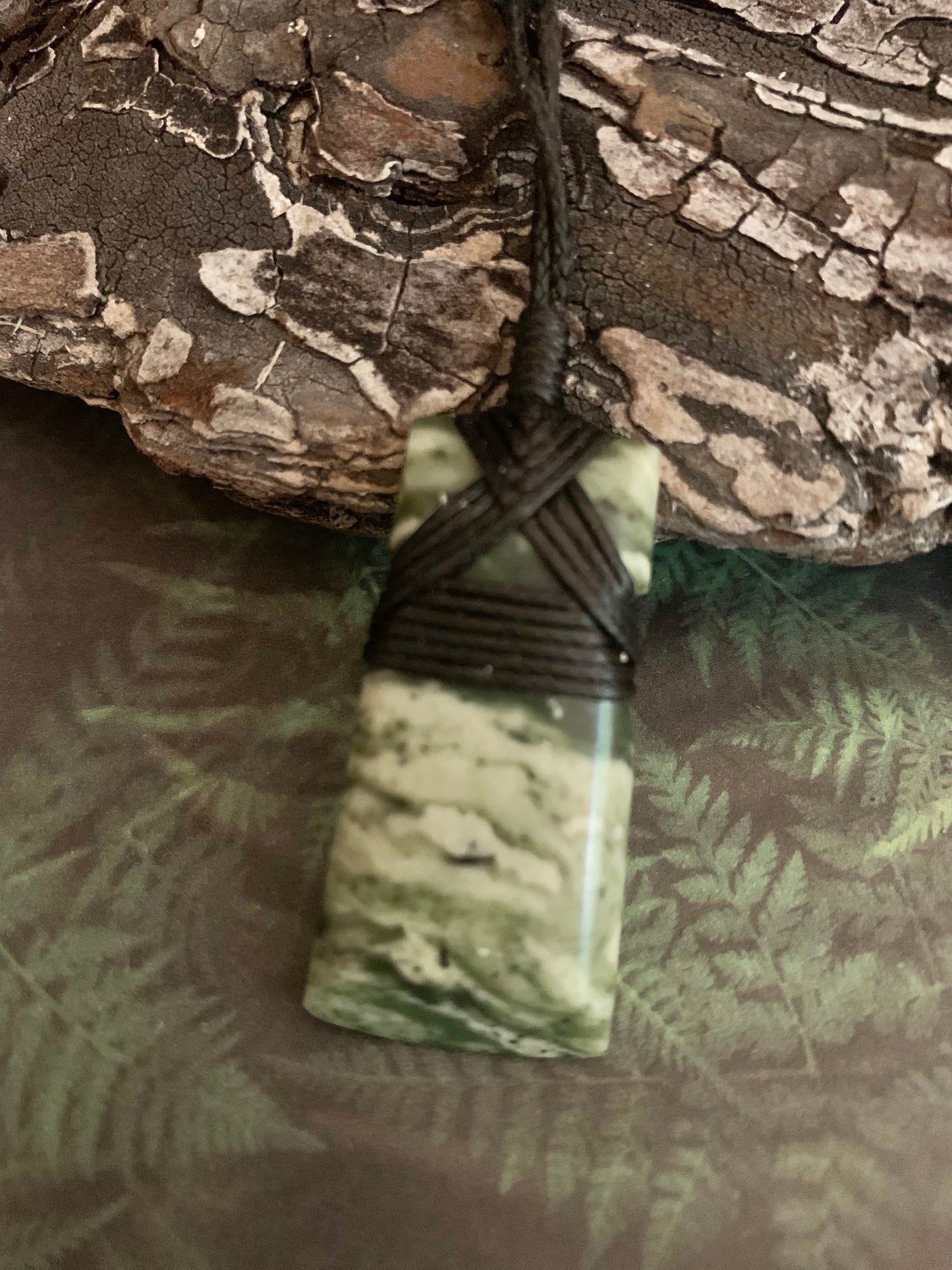 Maori Pounamu hei toki pendant from New Zealand available at Silver Fern Gallery