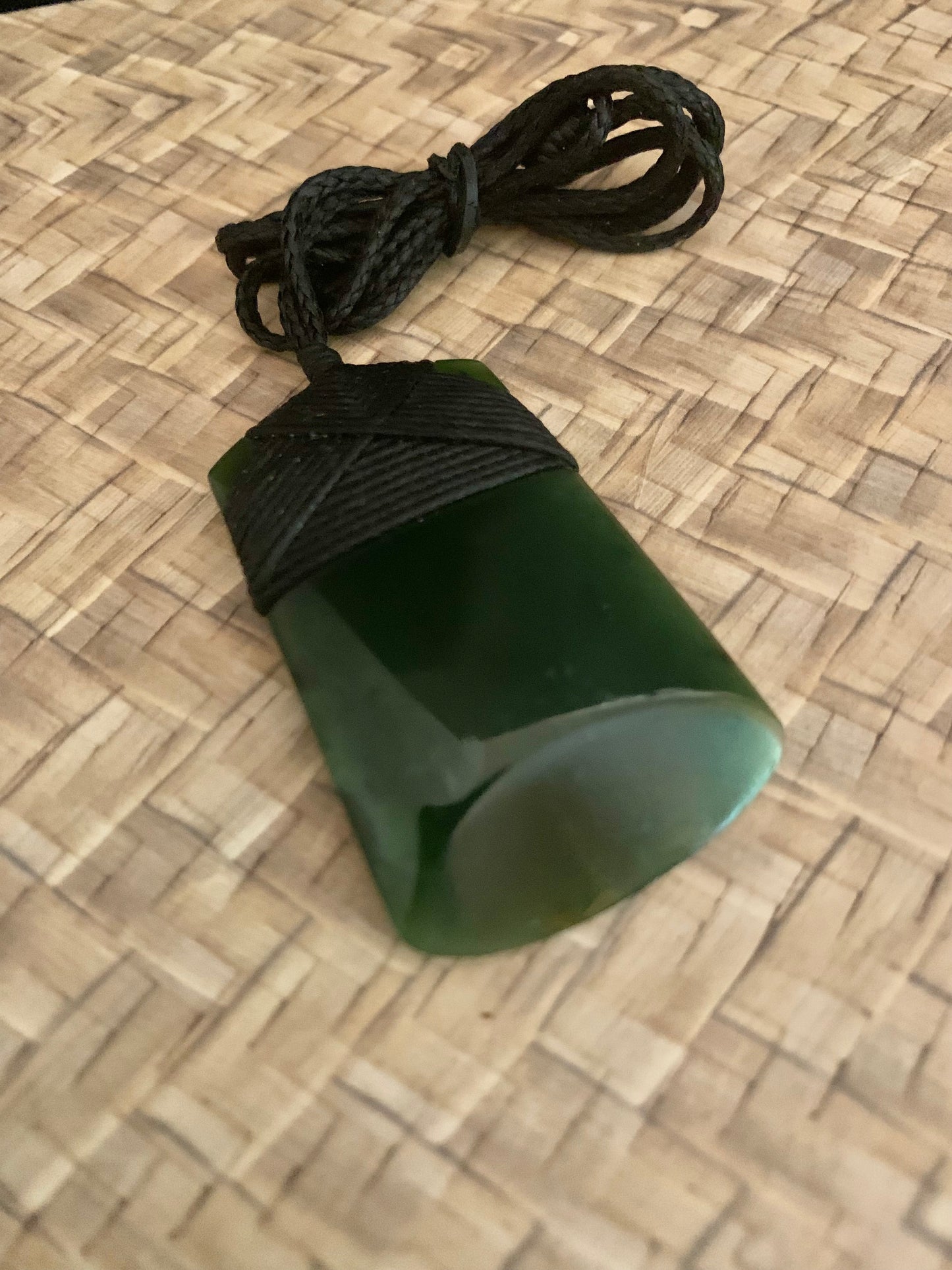 Maori Pounamu hei toki adornment from New Zealand available at Silver Fern Gallery