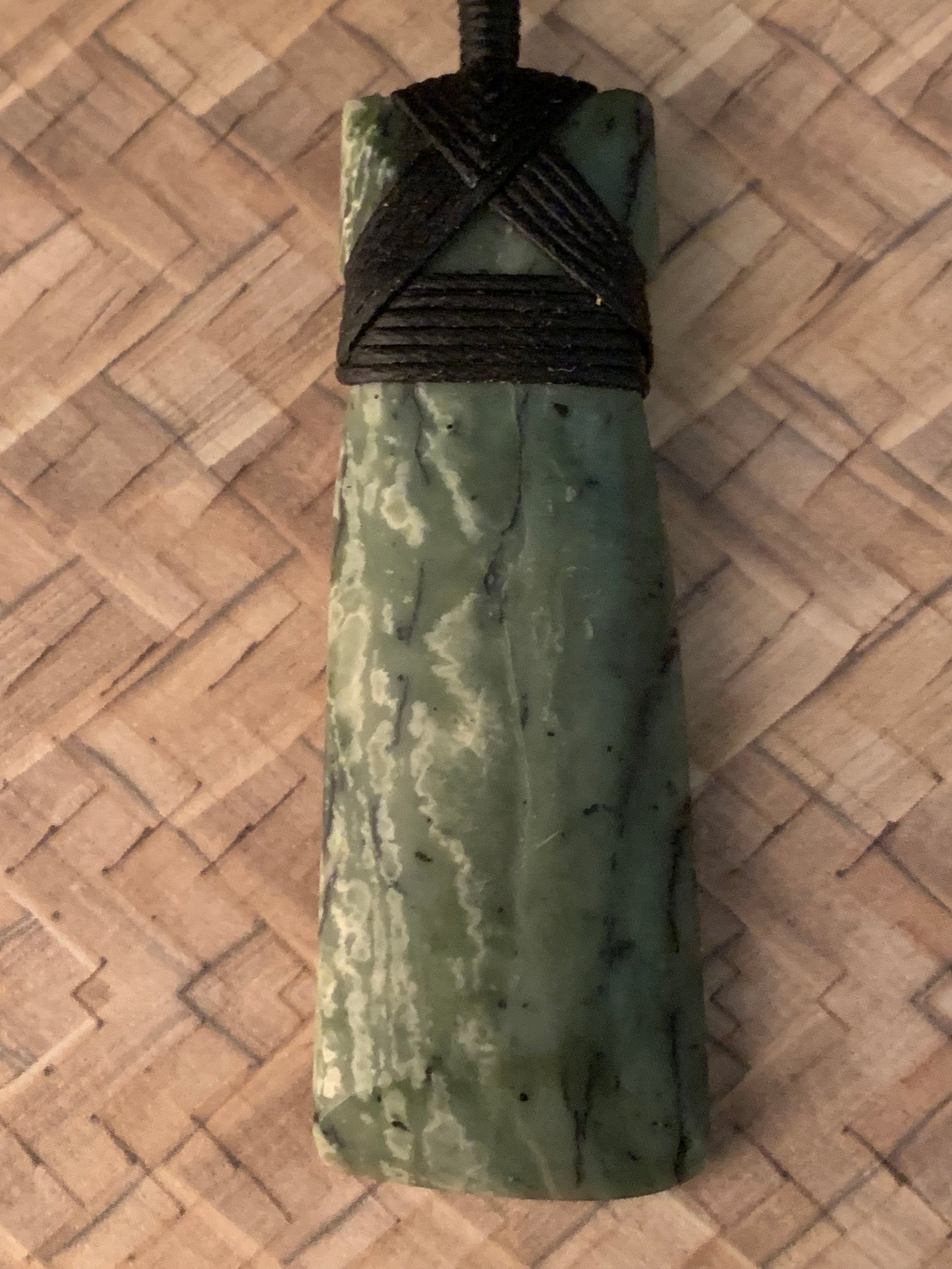 front side of Maori Pounamu hei toki pendant from New Zealand available to purchase at Silver Fern Gallery