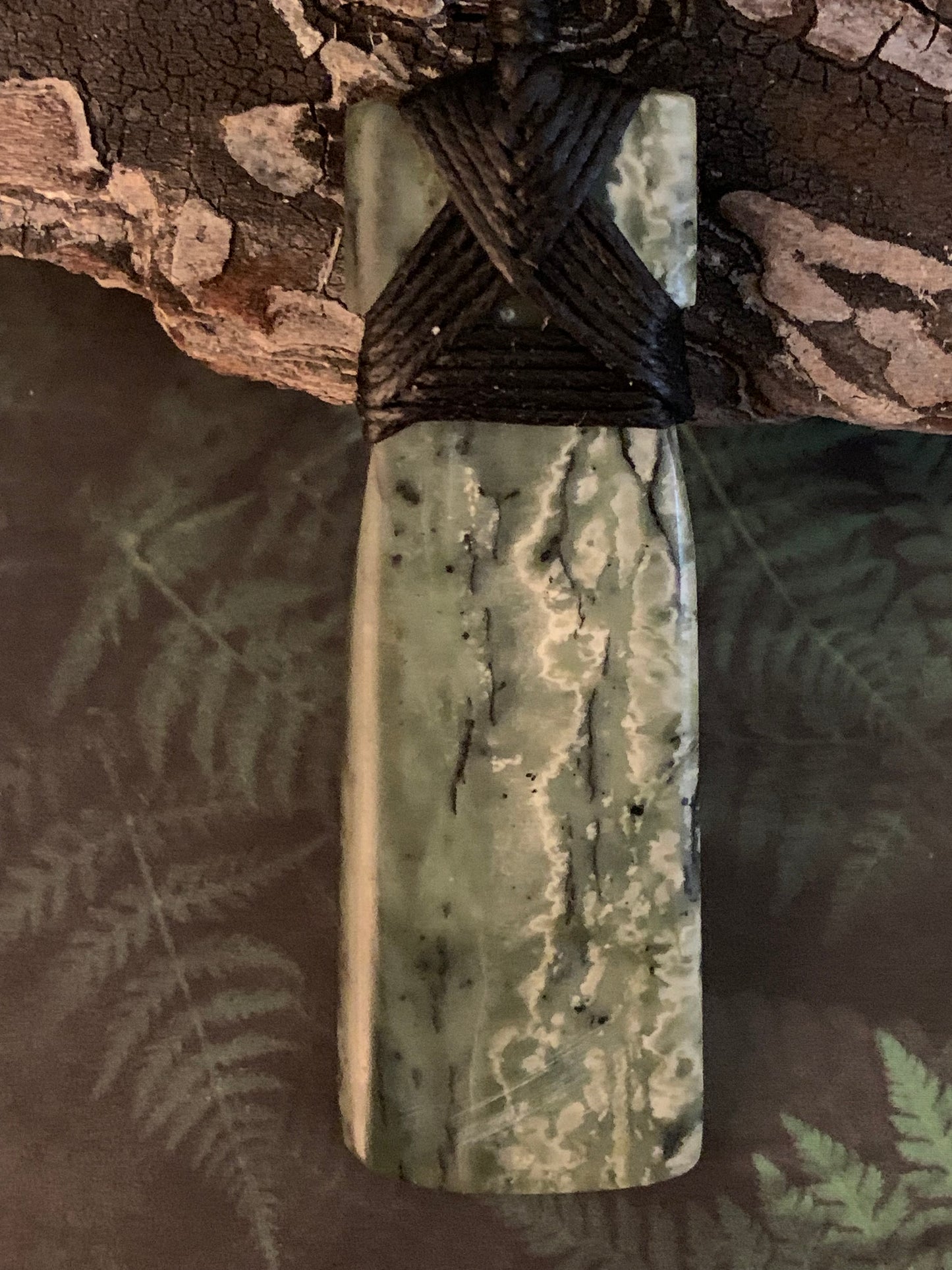 Reverse side of Maori Pounamu hei toki pendant from New Zealand available to purchase at Silver Fern Gallery