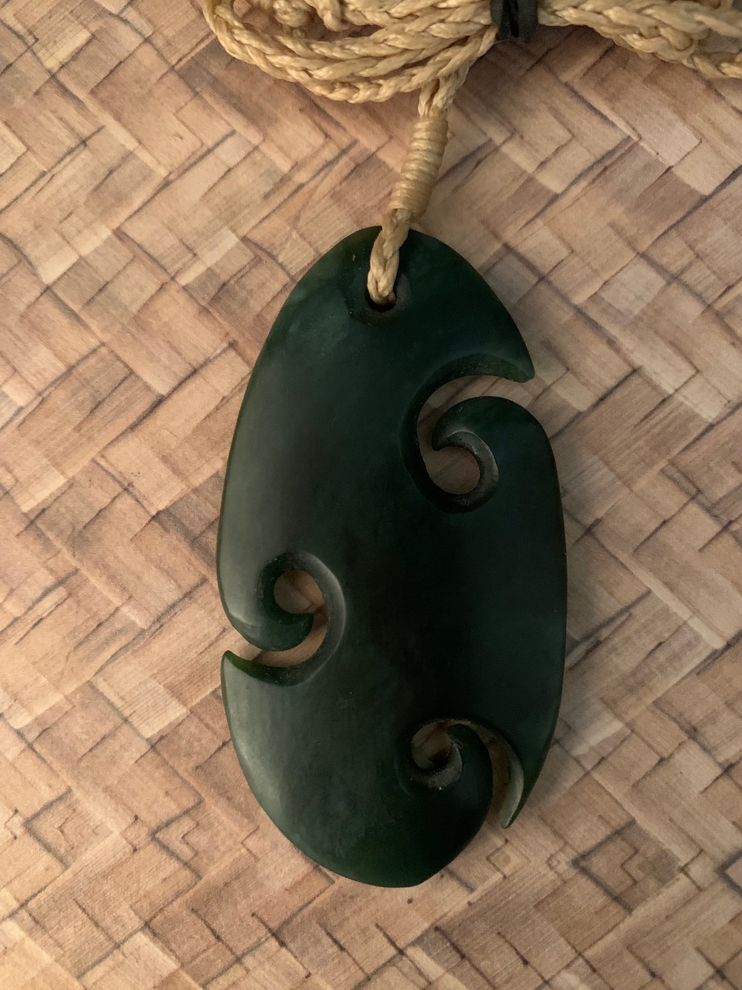 front view of Pounamu koru pendant from New Zealand available from Silver Fern Gallery