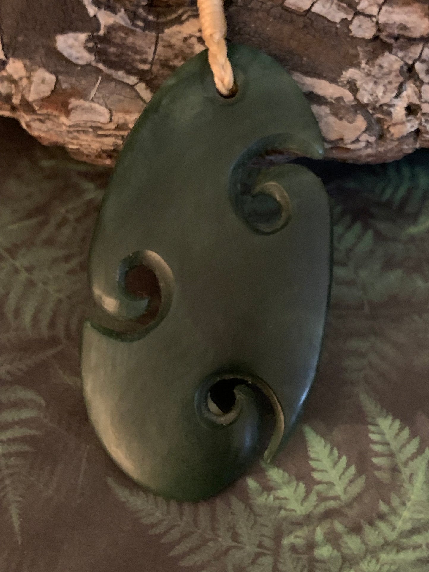 Pounamu triple koru pendant from New Zealand available from Silver Fern Gallery
