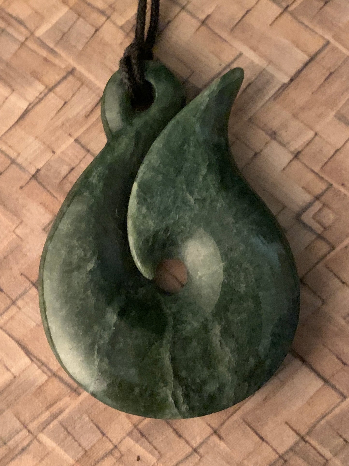 New Zealand Maori hei matau greenstone adornment available from Silver Fern gallery