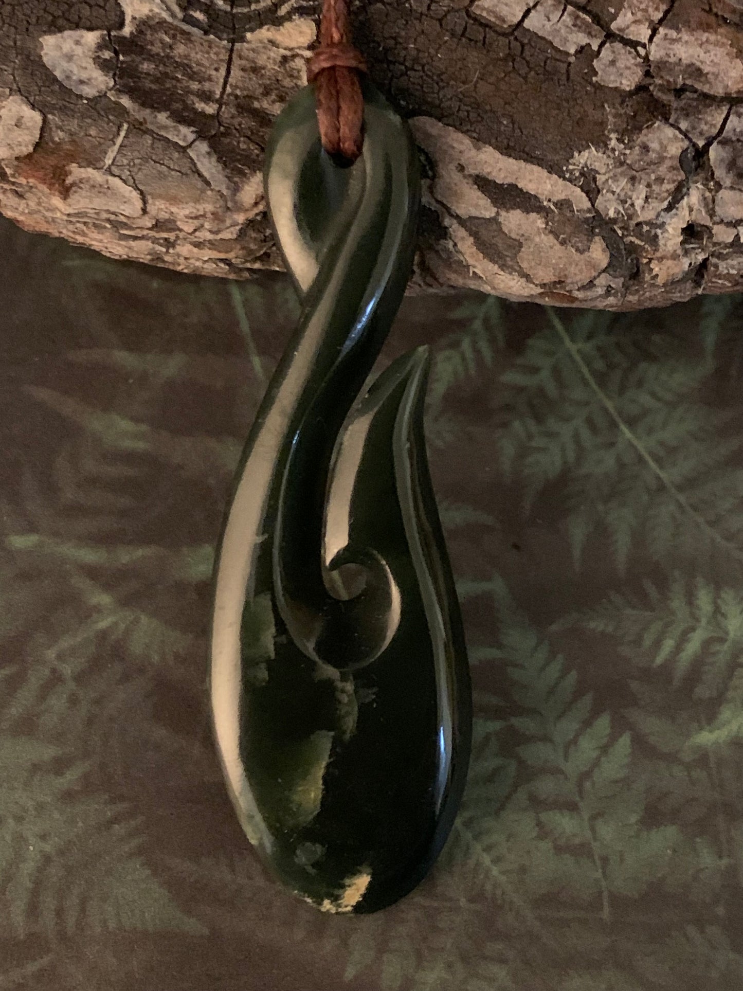 Maori made hei matau fish hook from New Zealand Pounamu greenstone jade