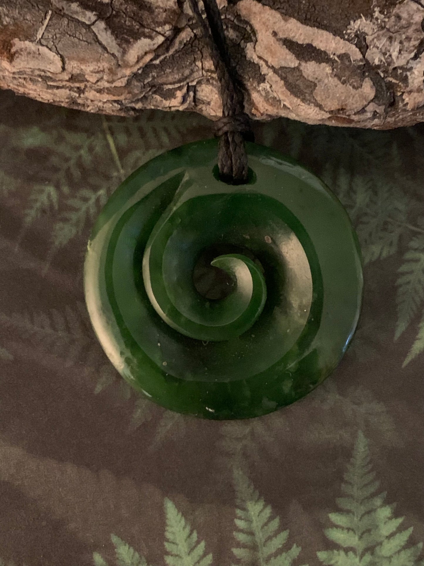 Pounamu koru pendant from New Zealand available from Silver Fern Gallery Queenstown