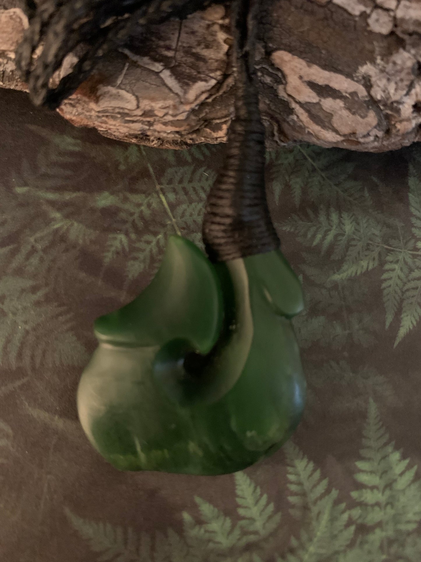 Maori made hei matau fish hook from New Zealand Pounamu greenstone jade