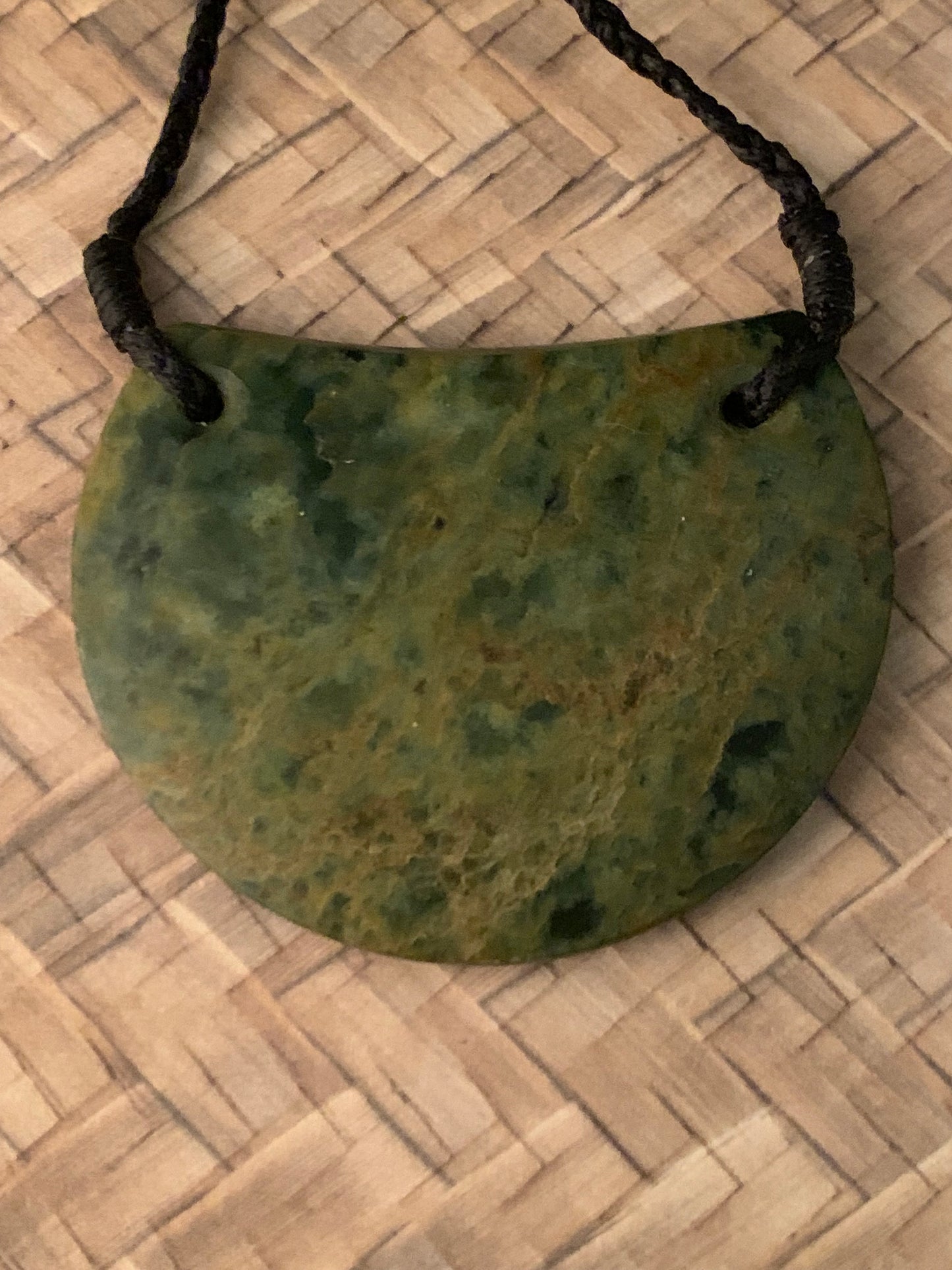front view of New Zealand Maori breast plate pounamu adornment available from Silver Fern gallery