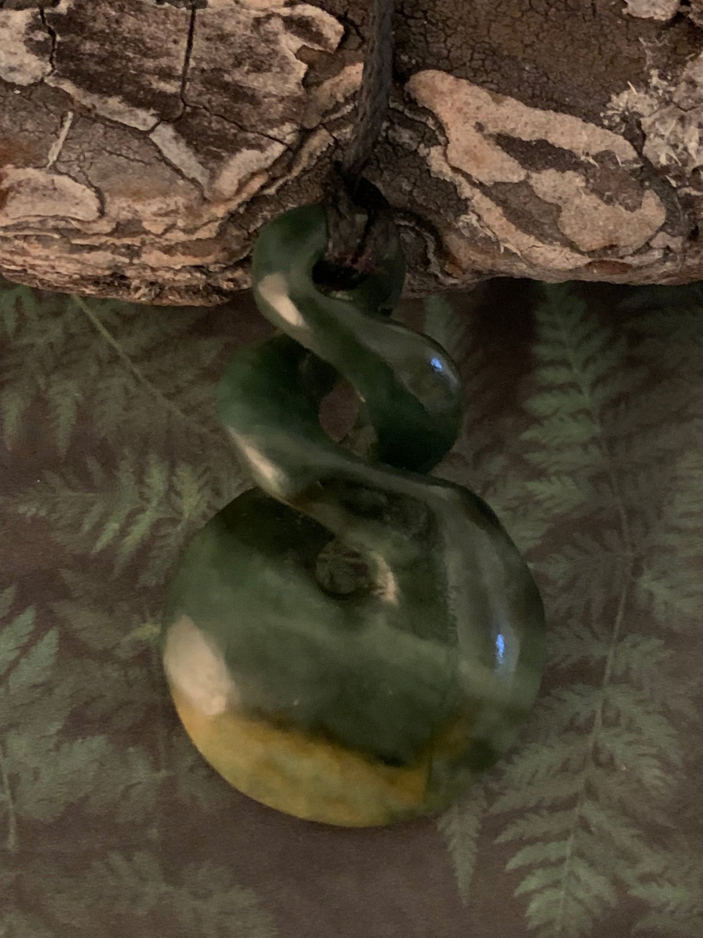 reverse of Maori Pounamu hei matau pendant from New Zealand available to purchase