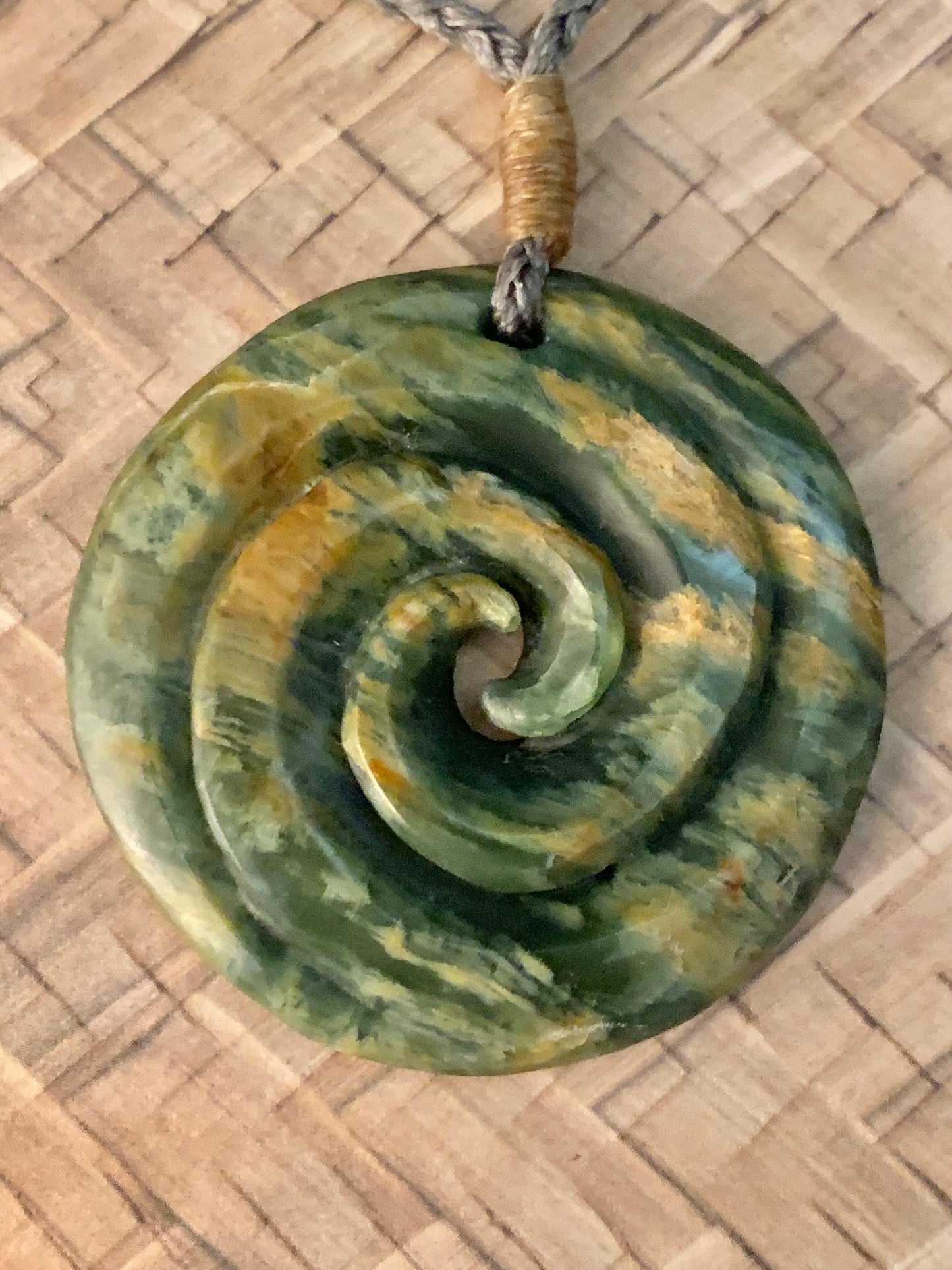 Pounamu koru pendant from New Zealand available to purchase
