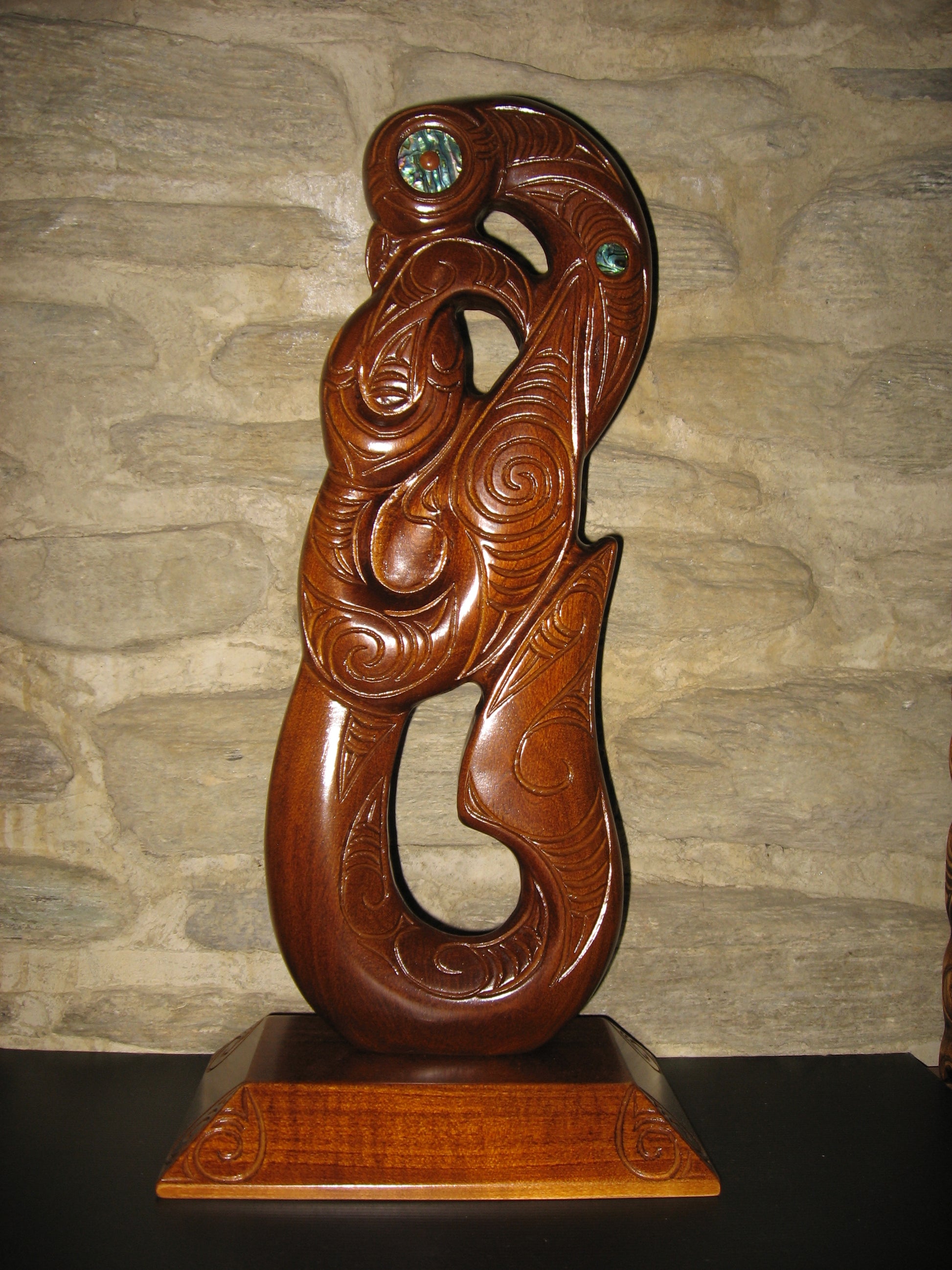 front view of matau fish hook on base by Wood Masters available from Silver Fern Gallery