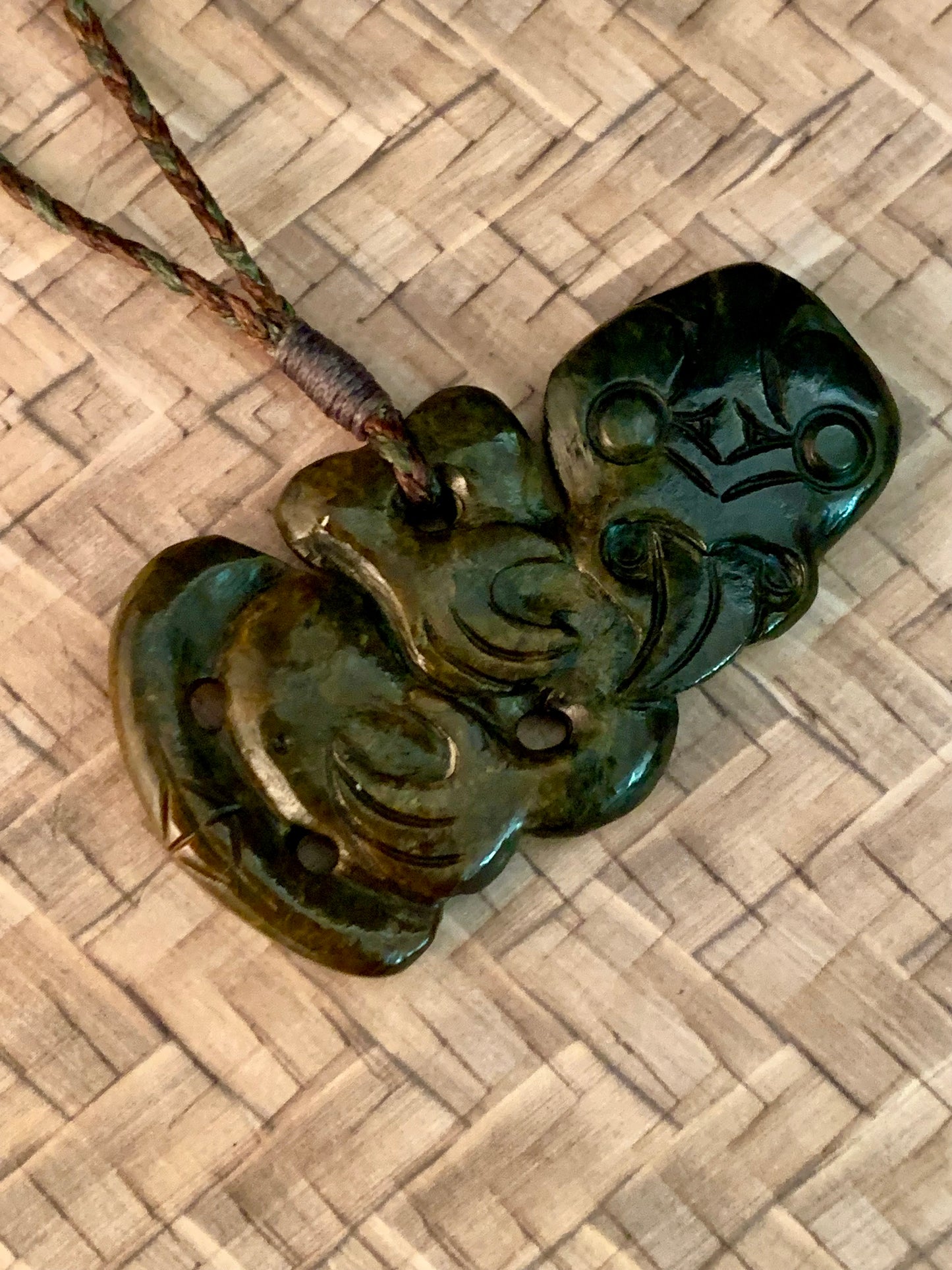 Maori tiki pendant from New Zealand. Regarded as a fertility symbol or good luck symbol.