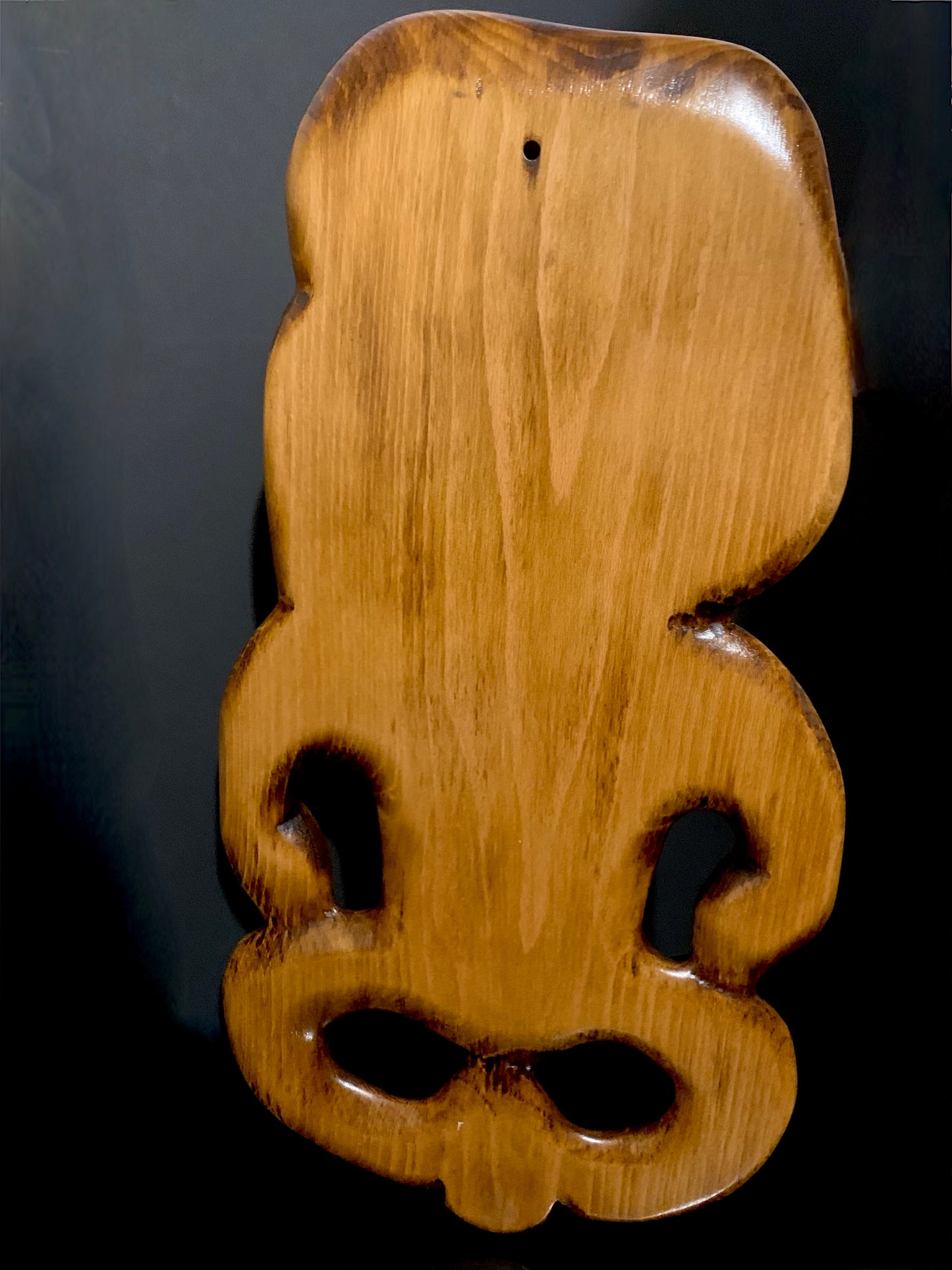 back view of large Maori tiki carved in New Zealand and available from Silver Fern Gallery