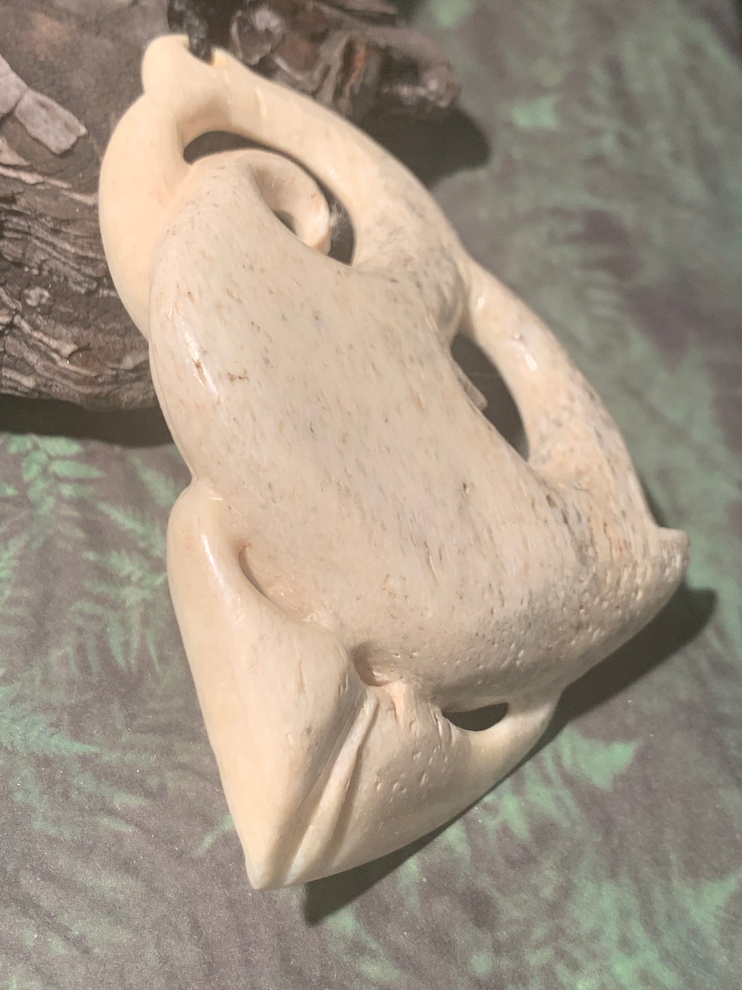 Side view of New Zealand Maori Whale Bone Pendant by Alex Sands Silver Fern Gallery