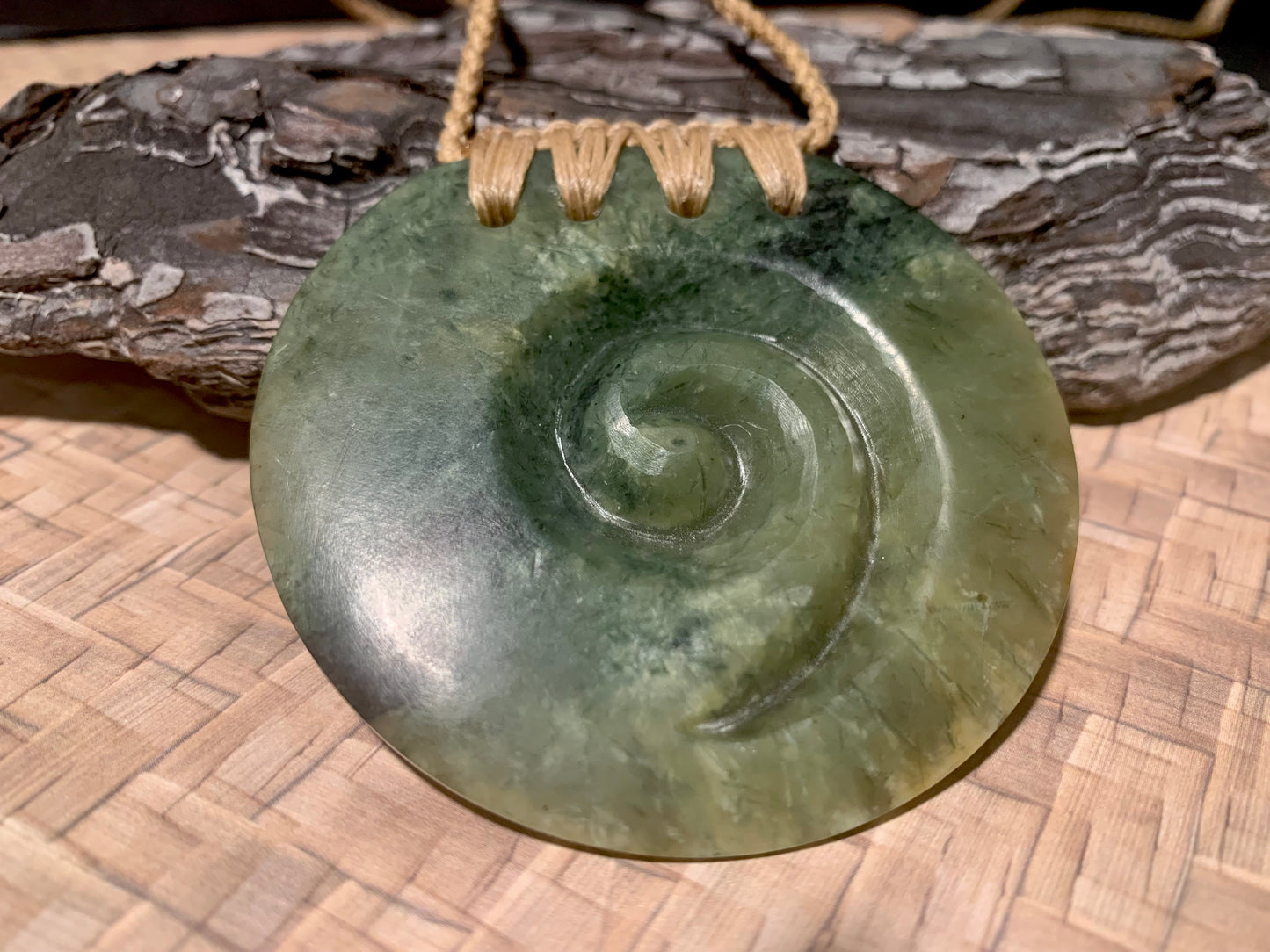 Pounamu Koru Porohita disc carved by Alex Sands 62mm