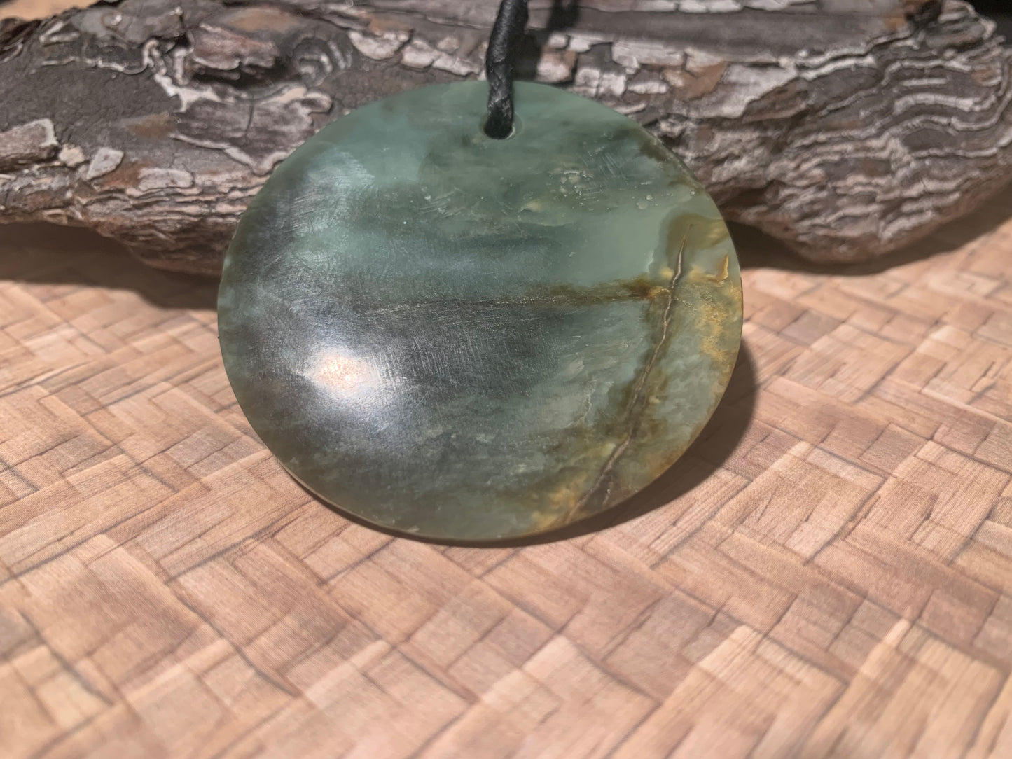 Pounamu Koru Porohita disc carved by Alex Sands 50mm