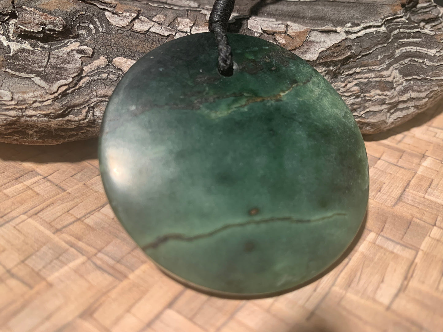 Revers side of Pounamu Koru Porohita disc made by Alex Sands 50mm
