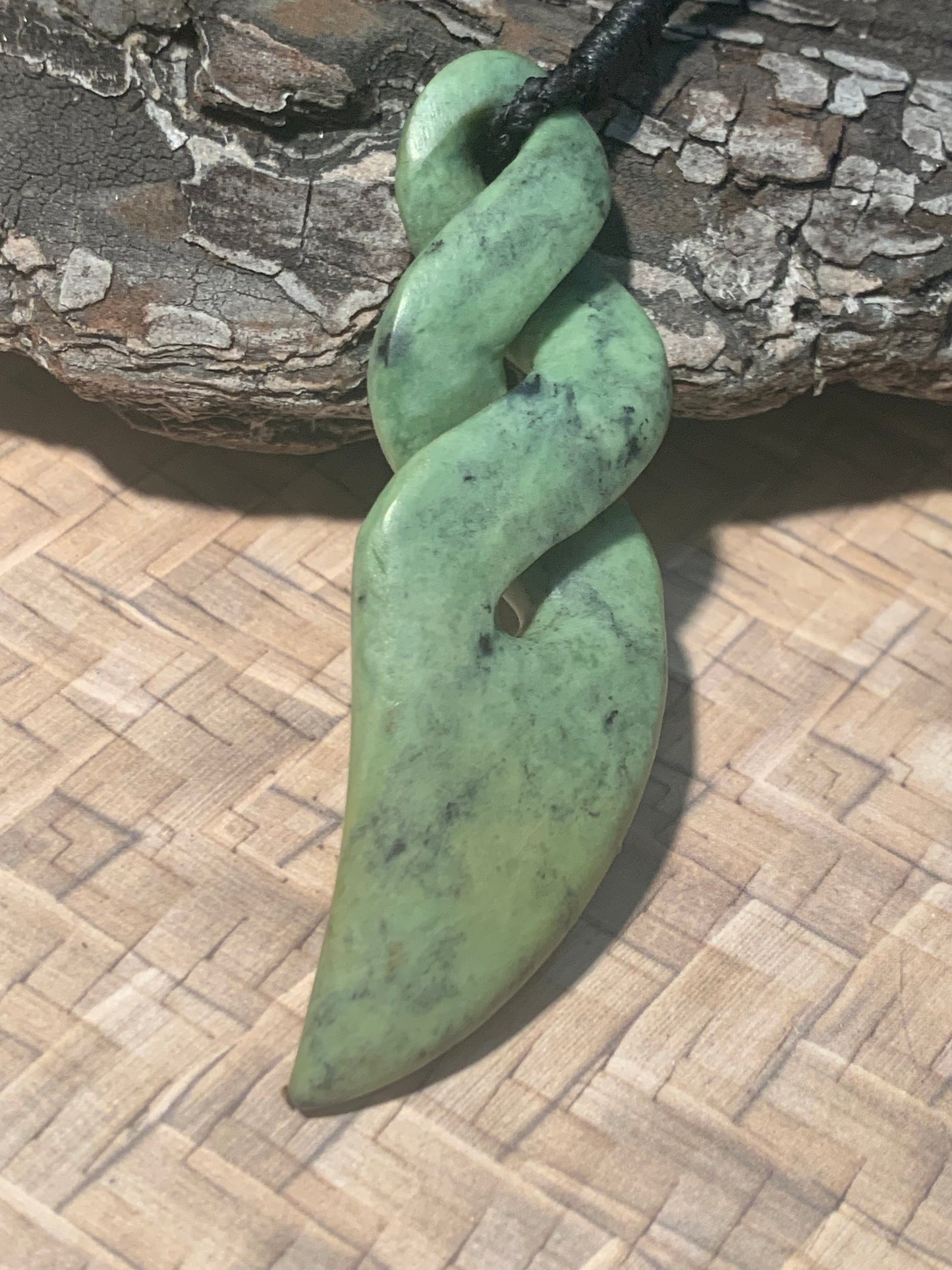 view of Pounamu Koru Porohita disc made by Alex Sands 50mm