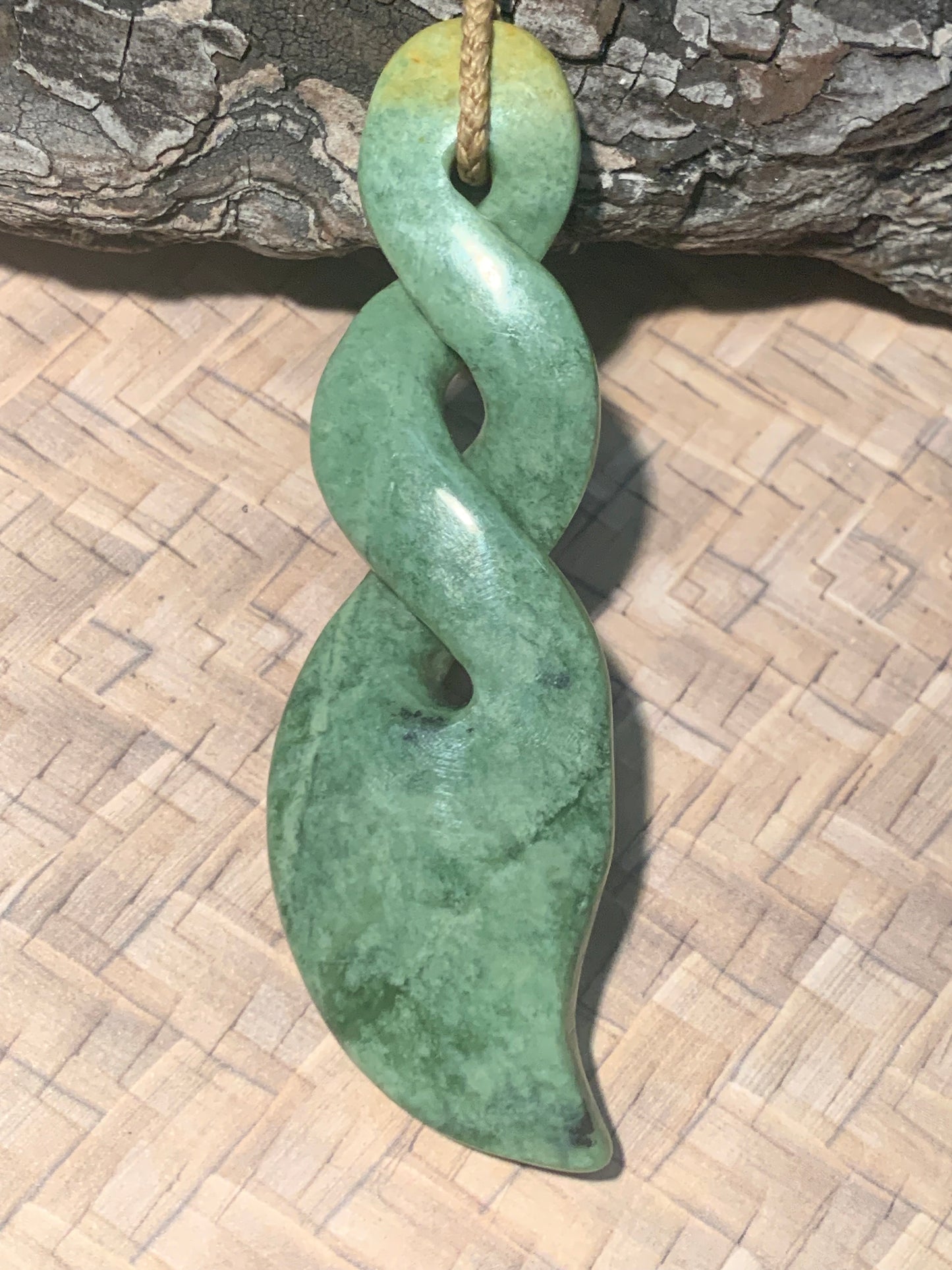 front view of Pounamu double twist by Alex Sands available for purchase