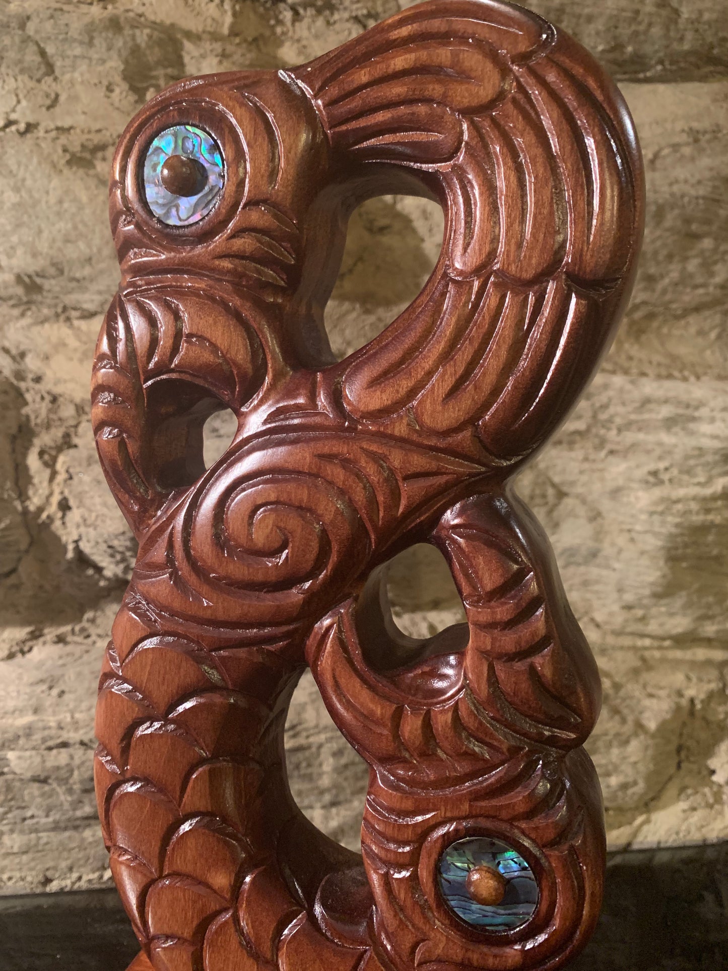 close up of Maori wood manaia on stand carved in New Zealand and available from Silver Fern Gallery