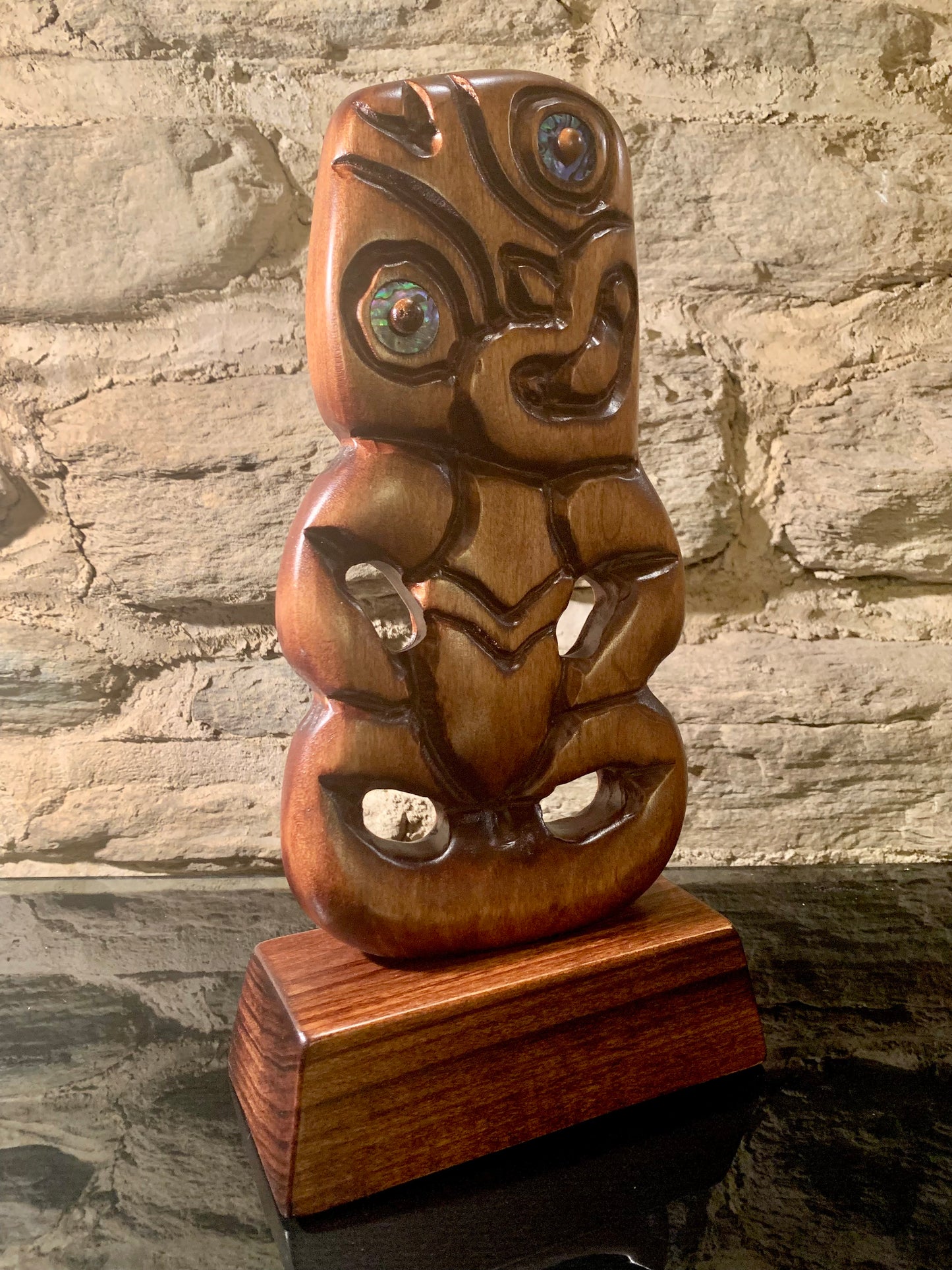 side angle of small Maori tiki carved in New Zealand and available from Silver Fern Gallery