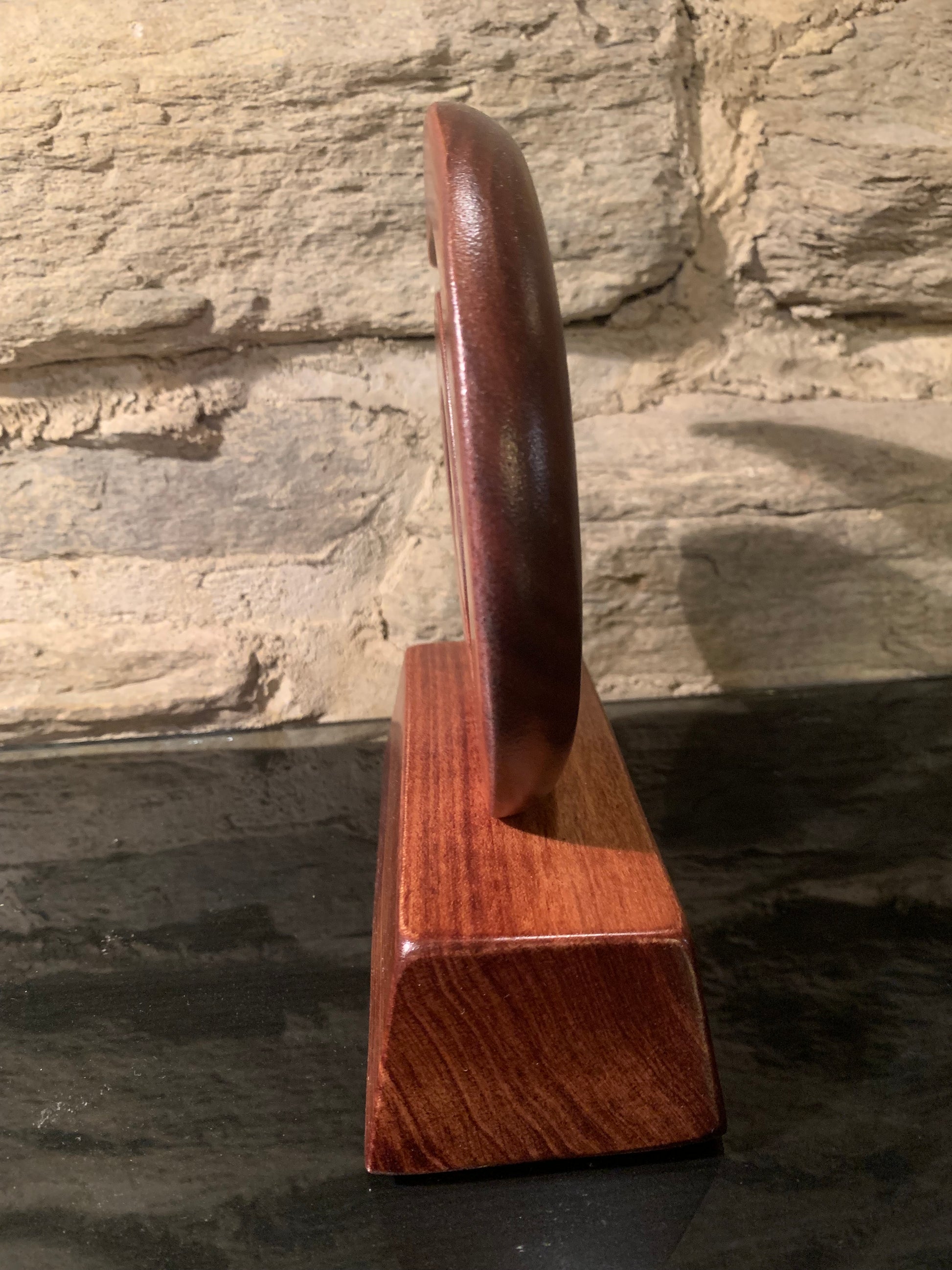 end view of Maori small koru on stand carved in New Zealand and available from Silver Fern Gallery
