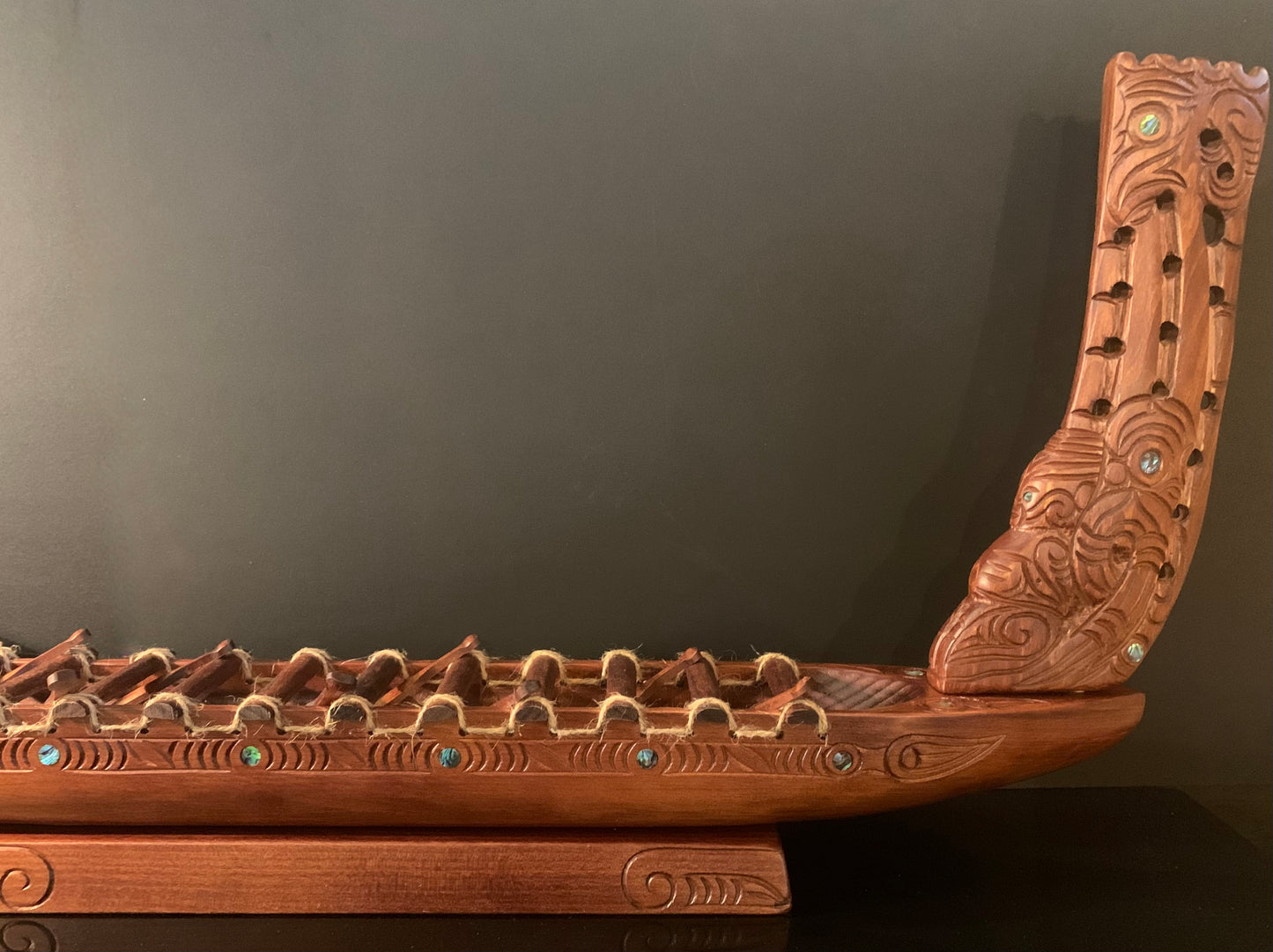 Carved Waka Taua on stand - by Wood Masters