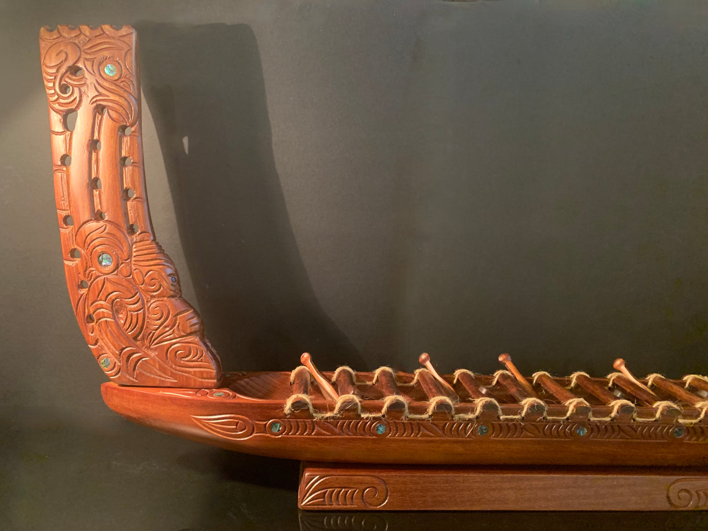 Carved Waka Taua on stand - by Wood Masters