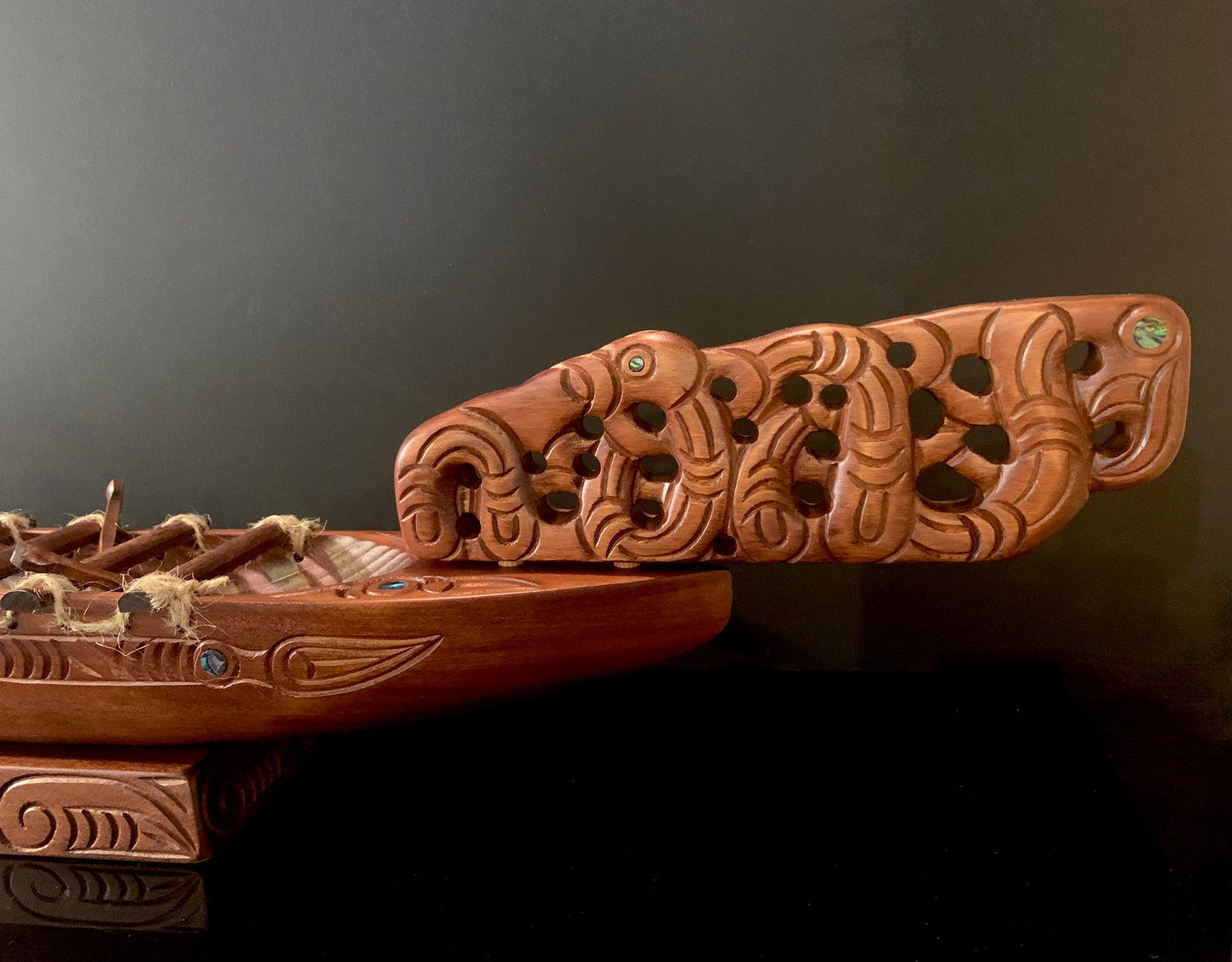 Carved Waka Taua on stand - by Wood Masters
