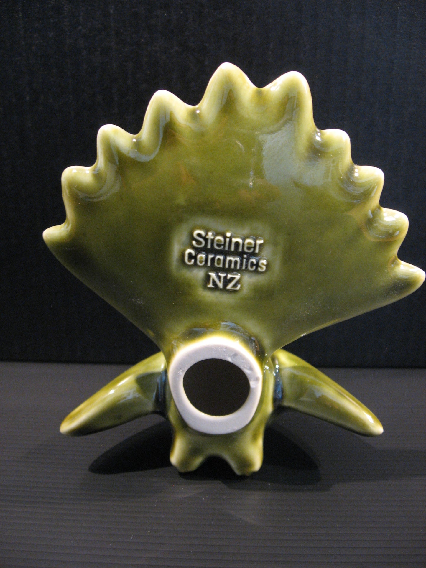 Back view of Ceramic Piwakawaka (Fantail) by Bob Steiner (moss green) Silver Fern Gallery