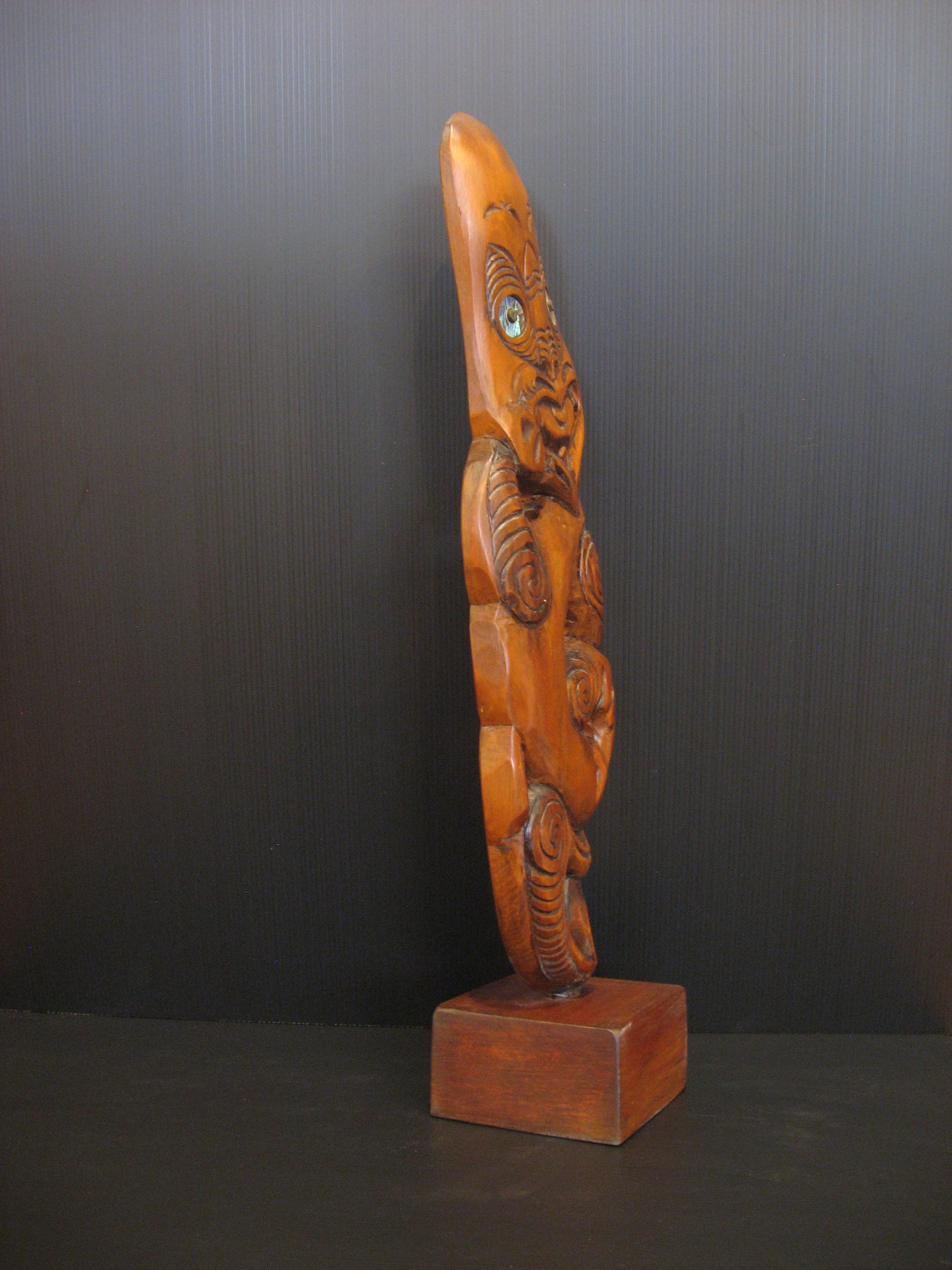 Side view of New Zealand Maori Tekoteko Carving by Gary Holder Silver Fern Gallery