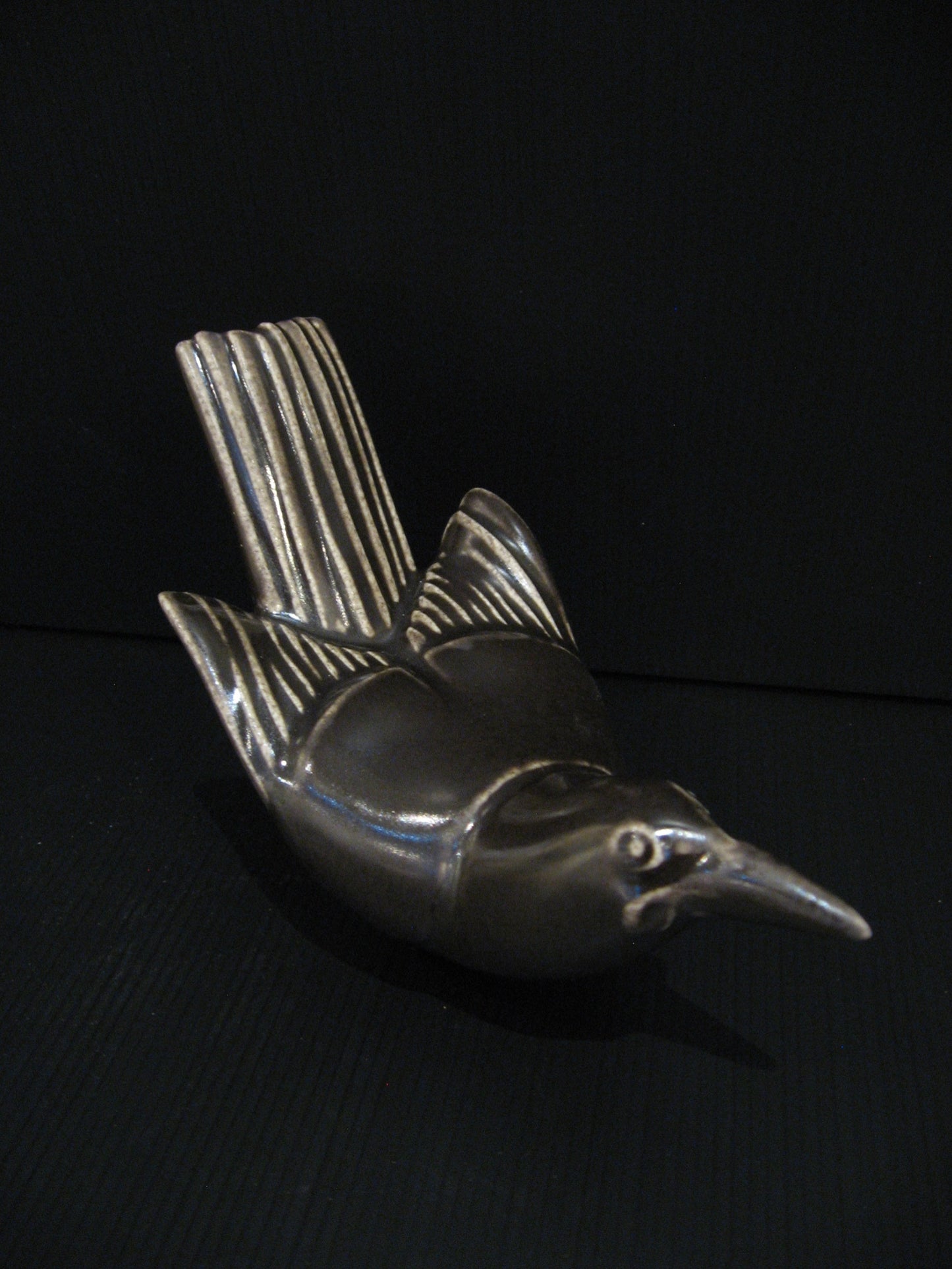 Side view of Ceramic Tieke (Saddleback) by Bob Steiner Silver Fern Gallery