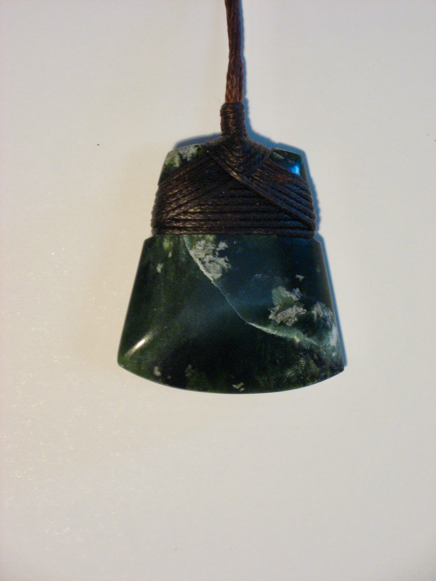 Pounamu Toki 35mm with lashed black cord Silver Fern GalleryMaori Pounamu hei toki pendant from New Zealand by Alex Sands available at Silver Fern Gallery